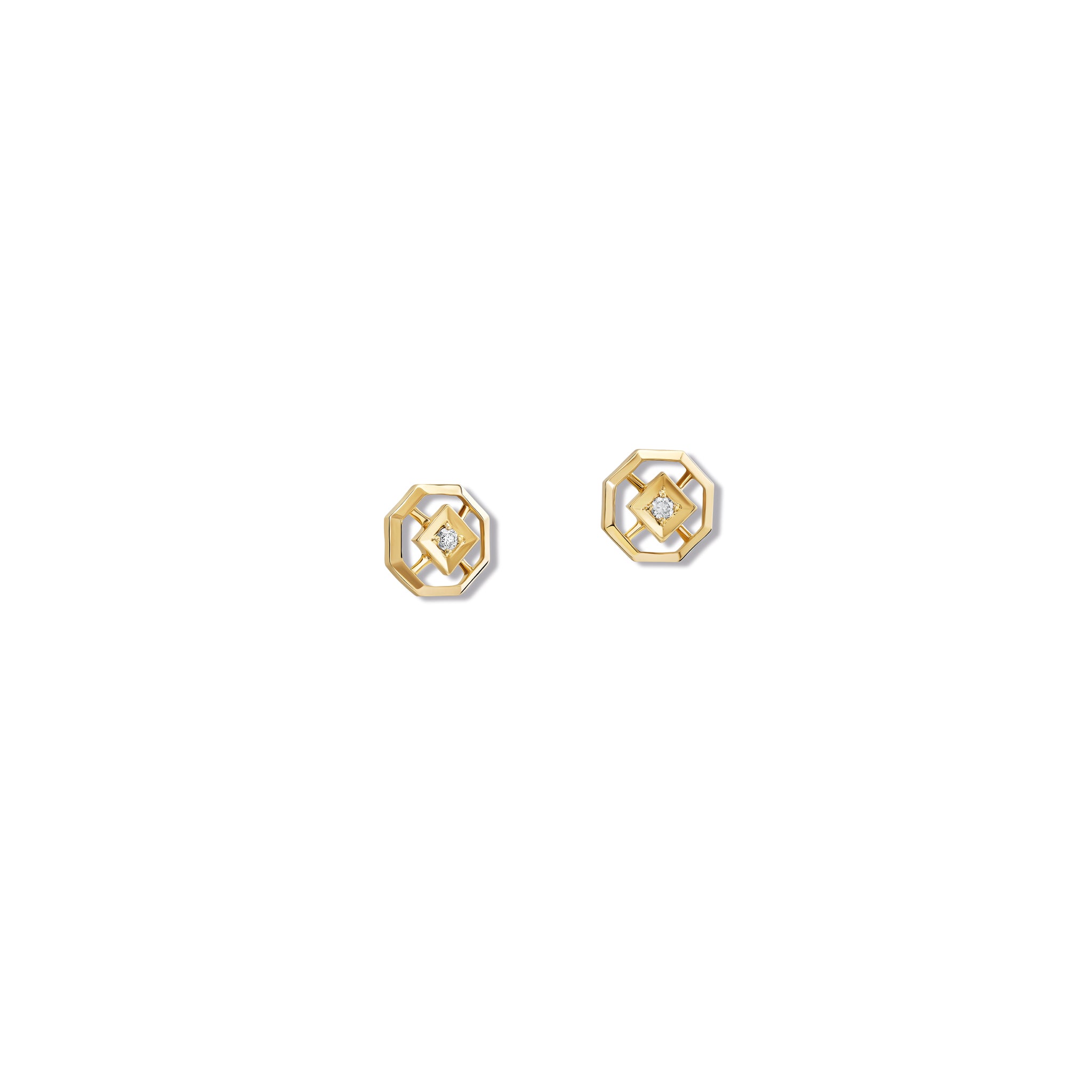 Handcrafted yellow gold stud earrings featuring an octagonal design with a central diamond, birthstone of April.