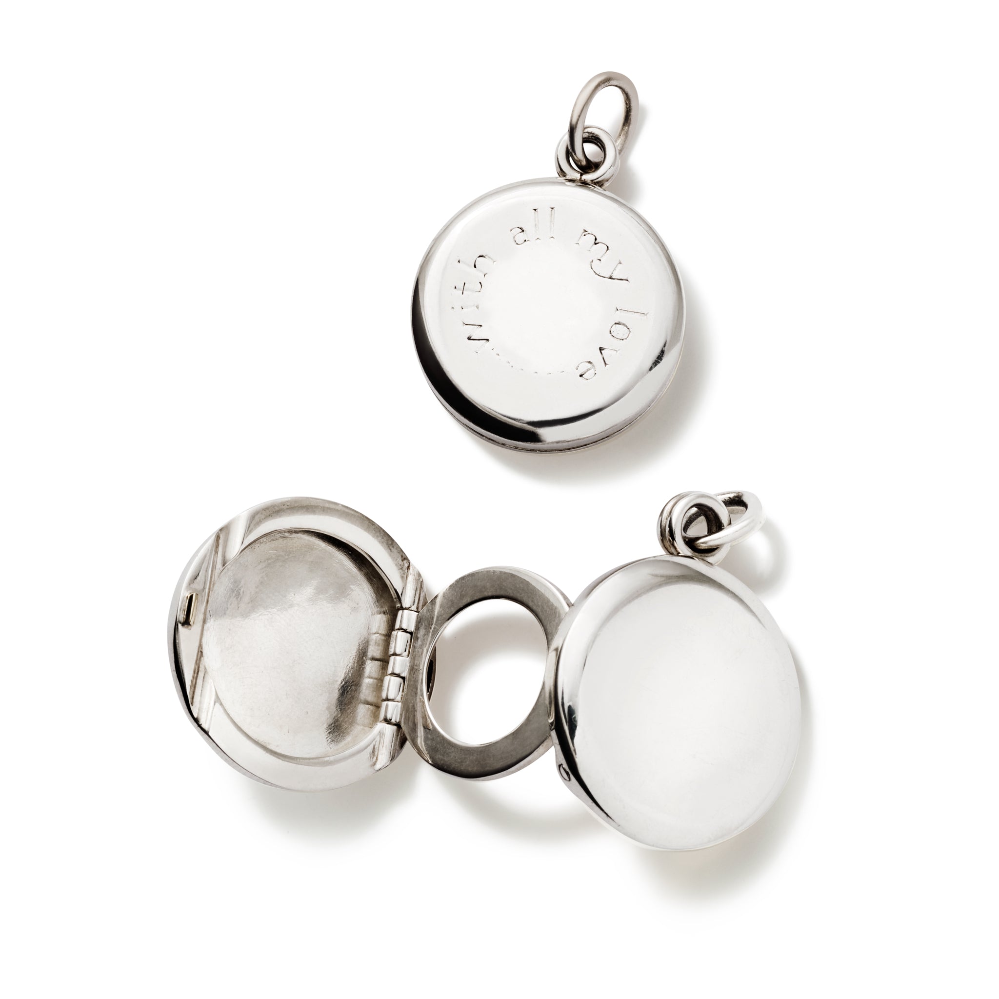 Handcrafted sterling silver locket necklace pendant that opens to reveal three photo frames.