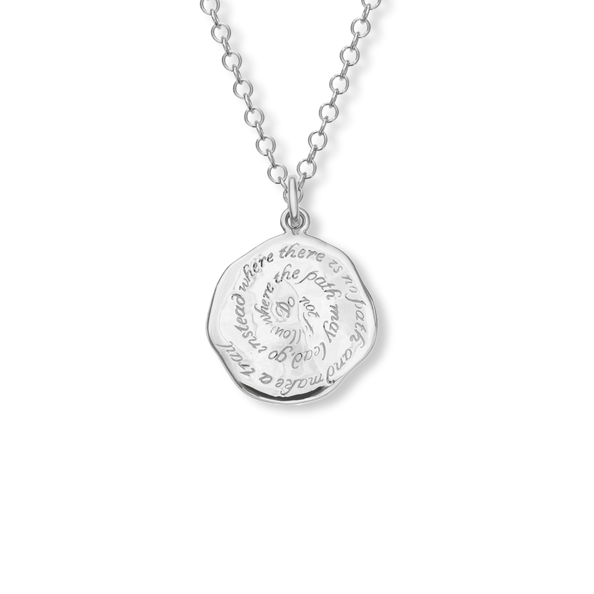 Handcrafted round sterling silver necklace pendant engraved with the quote, 'Do not follow where the path may lead, go instead where there is no path and make a trail.'