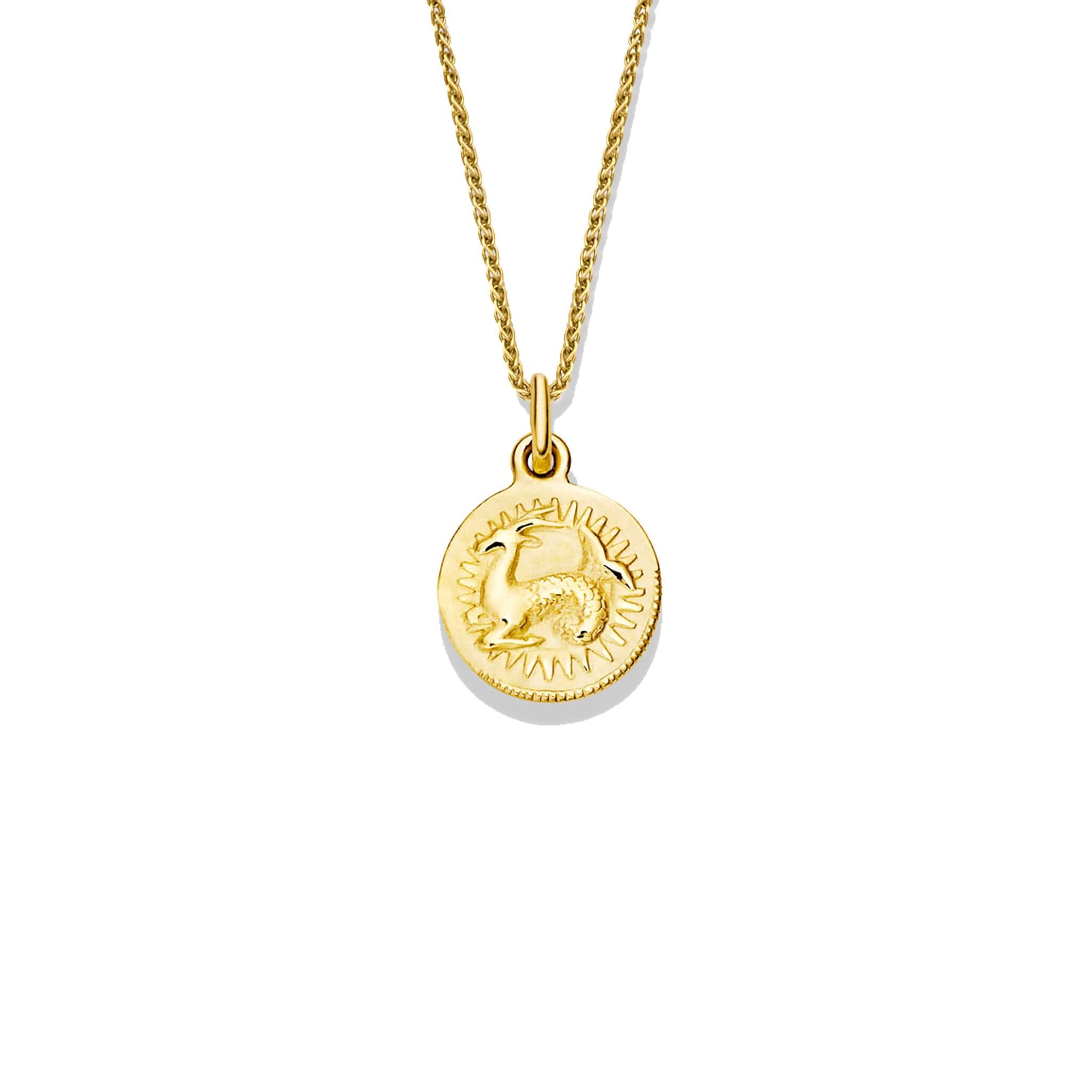 Handcrafted round yellow gold necklace pendant engraved with the zodiac capricorn.