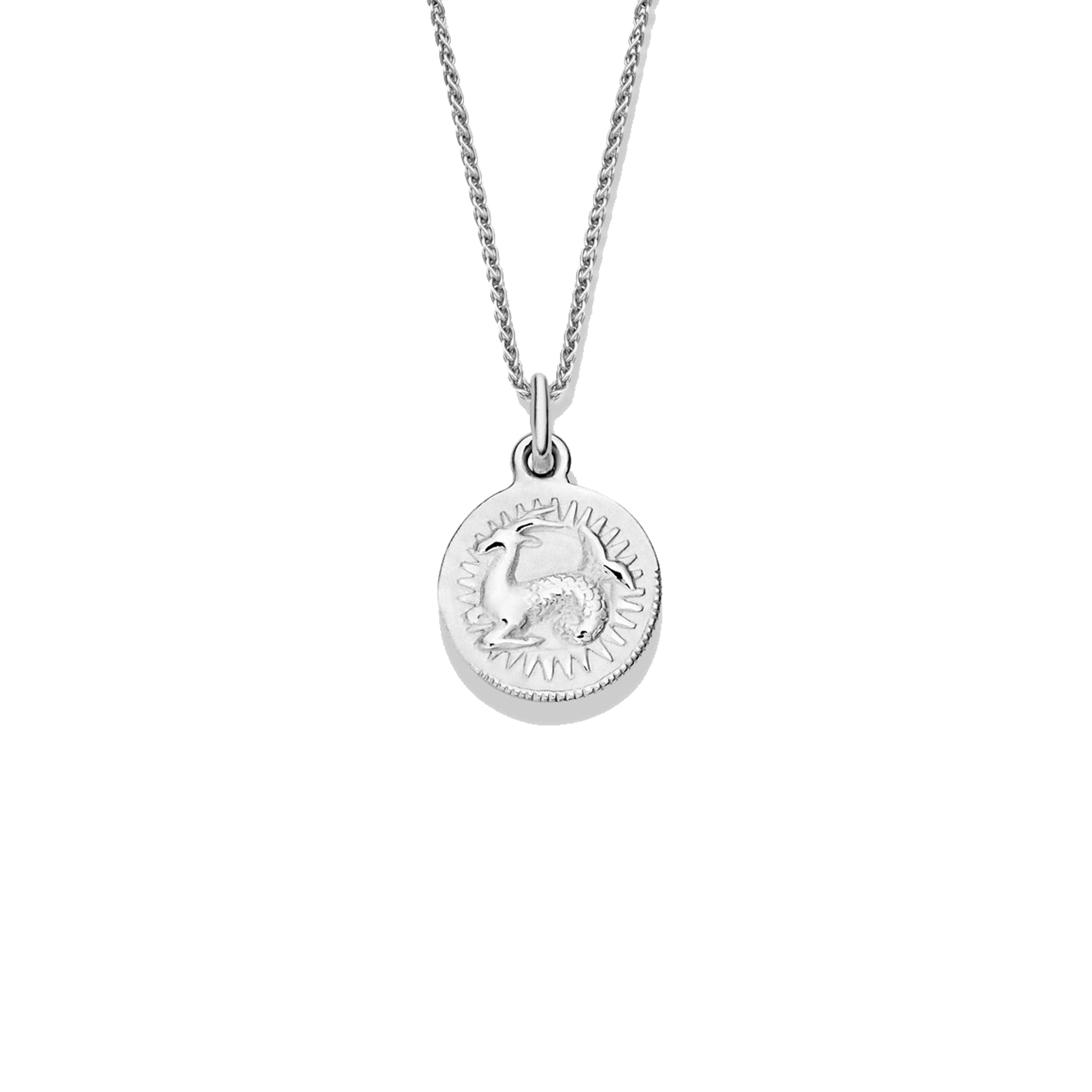 Handcrafted round sterling silver necklace pendant engraved with the zodiac capricorn.