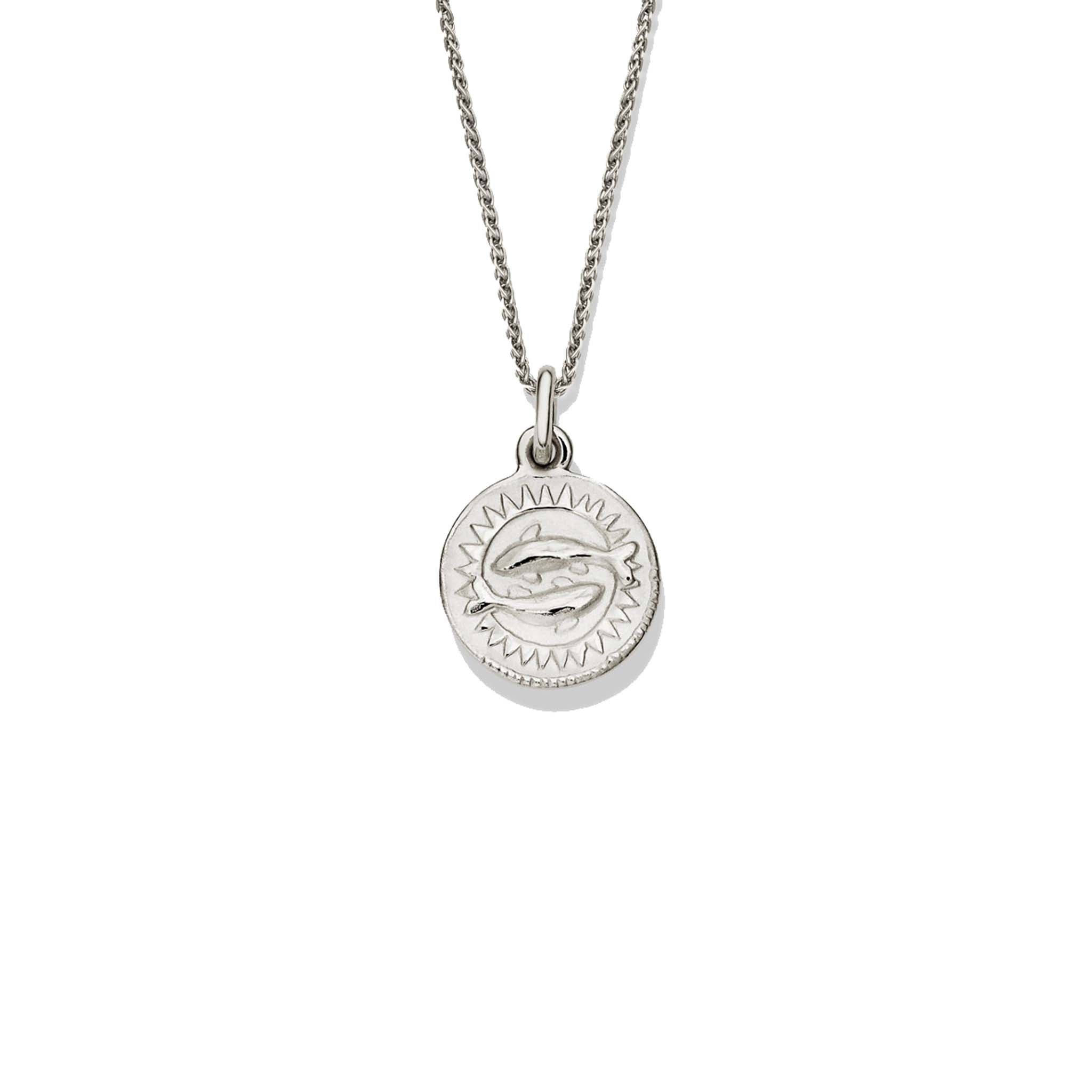 Handcrafted round sterling silver necklace pendant engraved with the zodiac pisces.