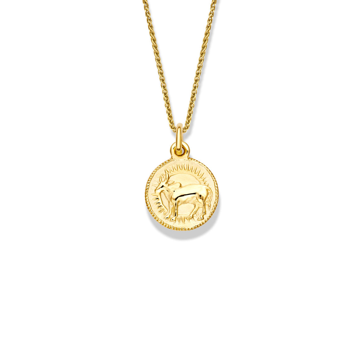 Handcrafted round yellow gold necklace pendant engraved with the zodiac taurus.