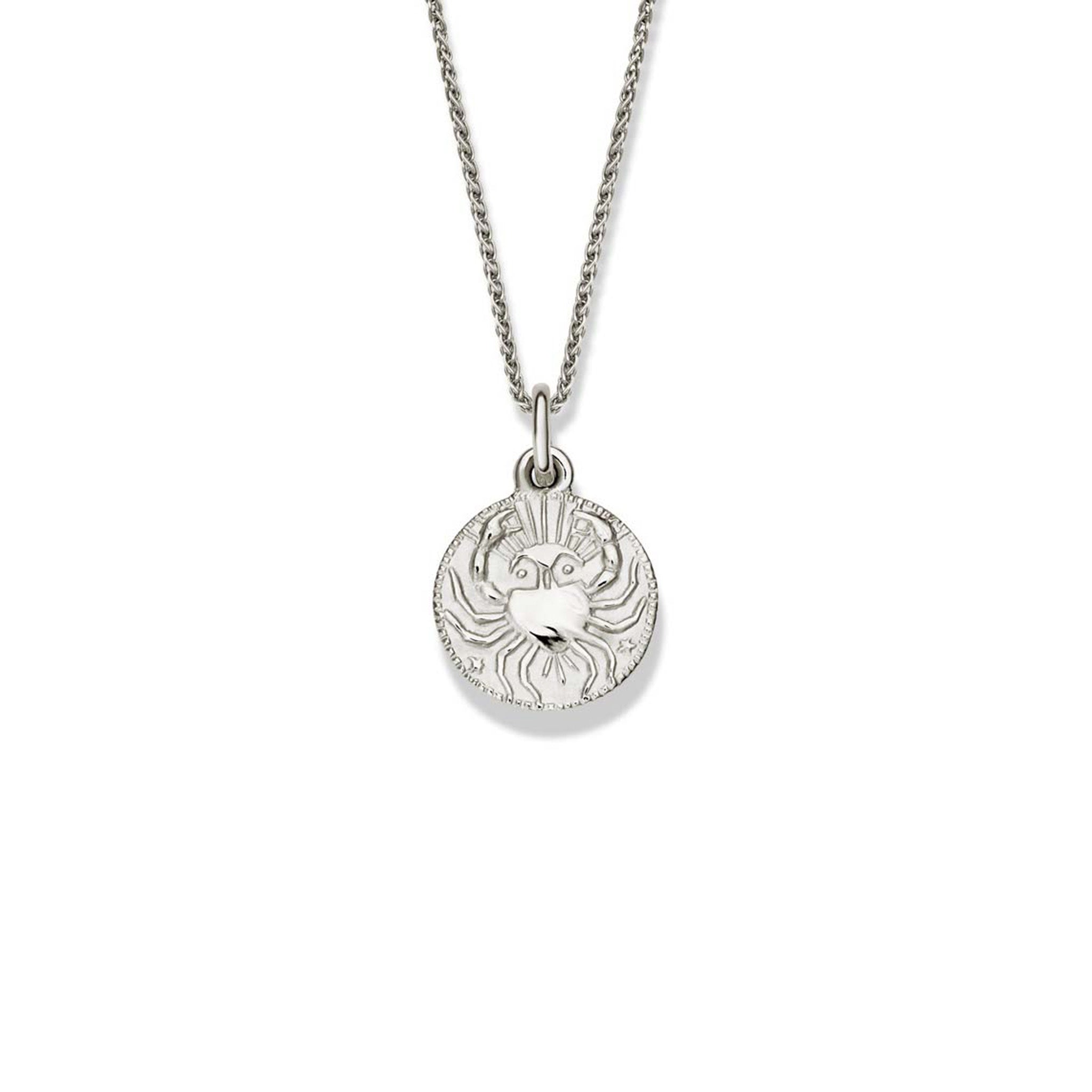 Handcrafted round sterling silver necklace pendant engraved with the zodiac cancer.