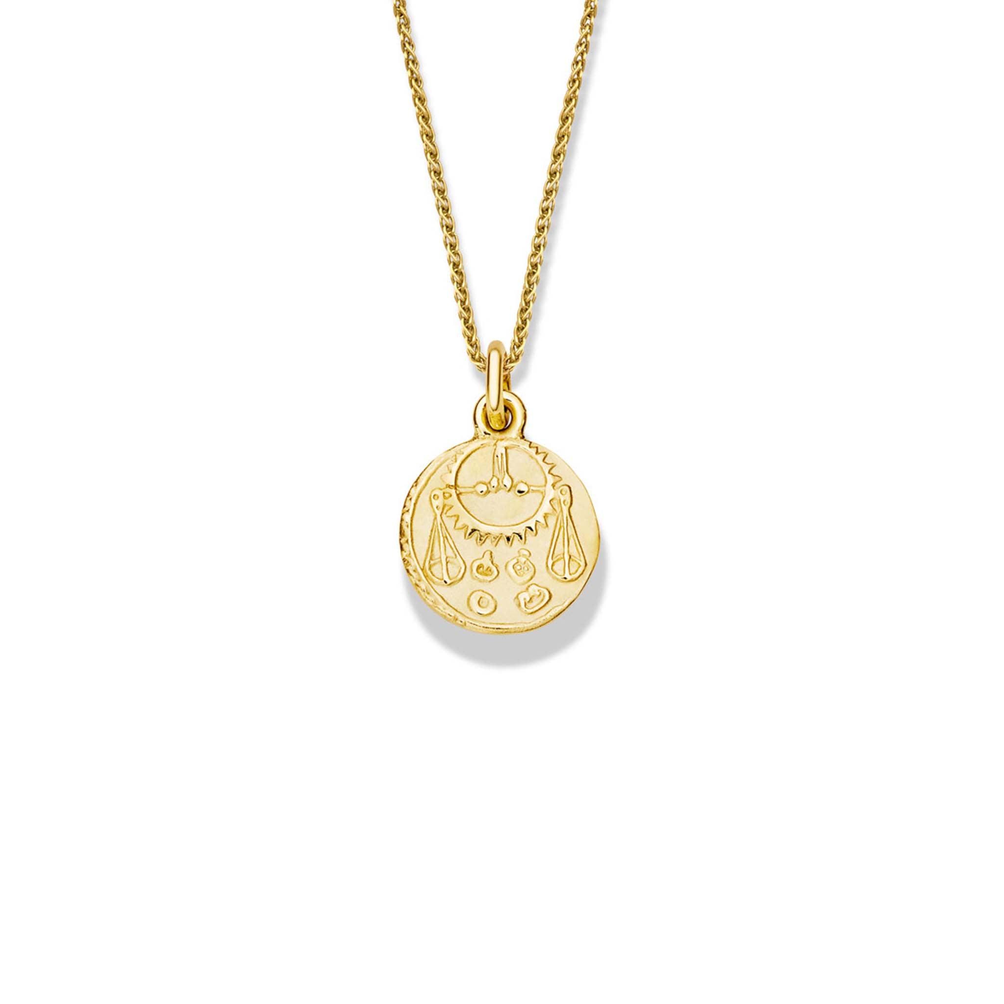 Handcrafted round yellow gold necklace pendant engraved with the zodiac libra.