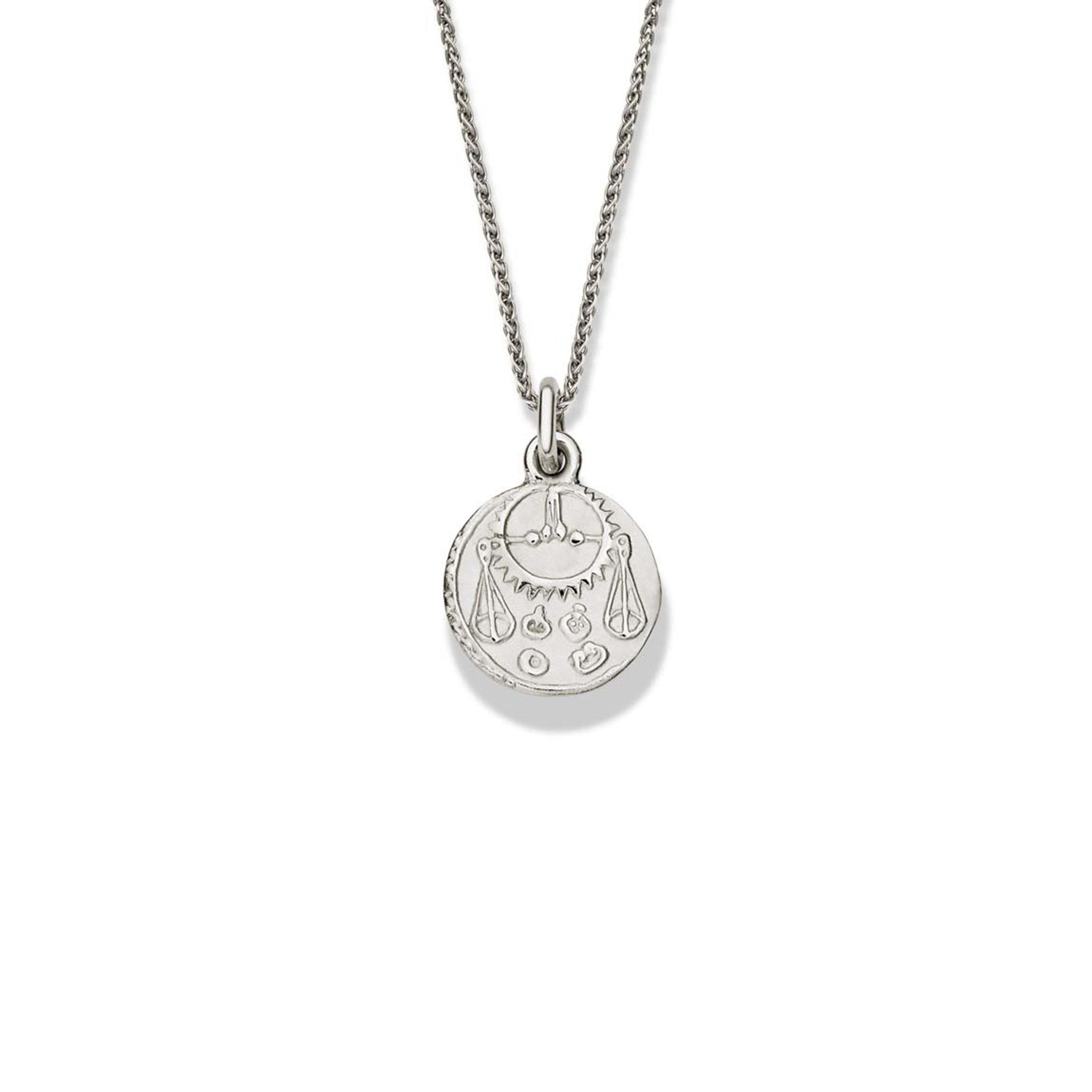 Handcrafted round sterling silver necklace pendant engraved with the zodiac libra.