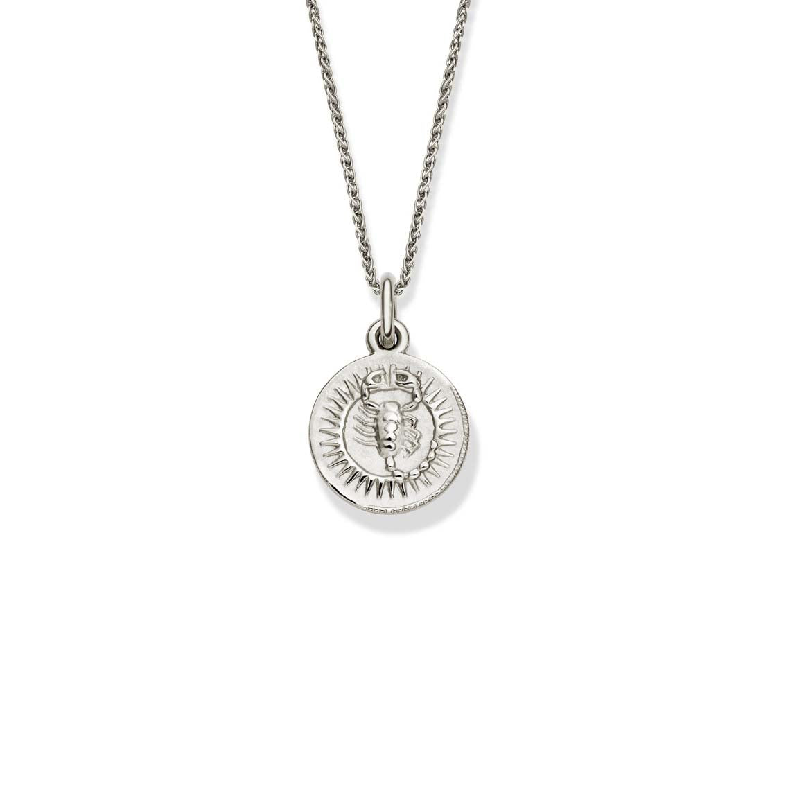 Handcrafted round sterling silver necklace pendant engraved with the zodiac scorpio.