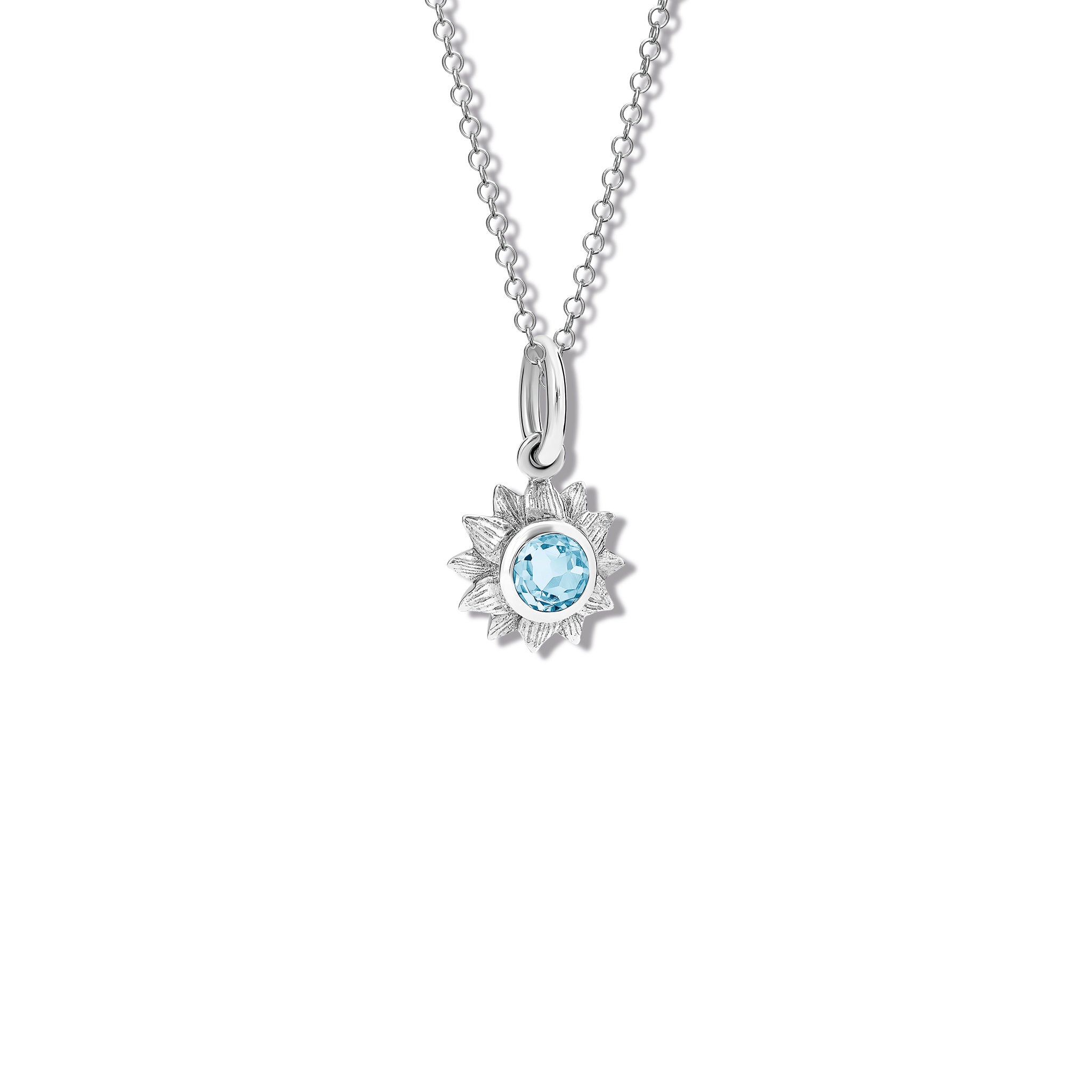 Handcrafted sterling silver sunflower necklace pendant featuring a central blue topaz, birthstone of November.