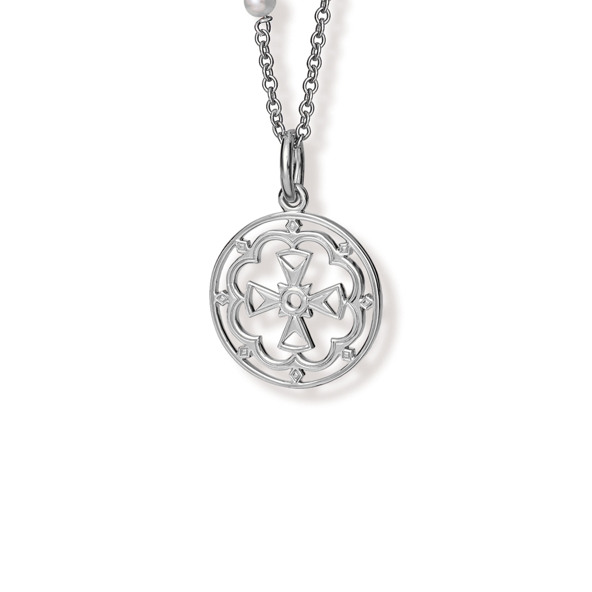 Handcrafted round sterling silver necklace pendant  featuring a cross in the middle, hanging from a silver chain.