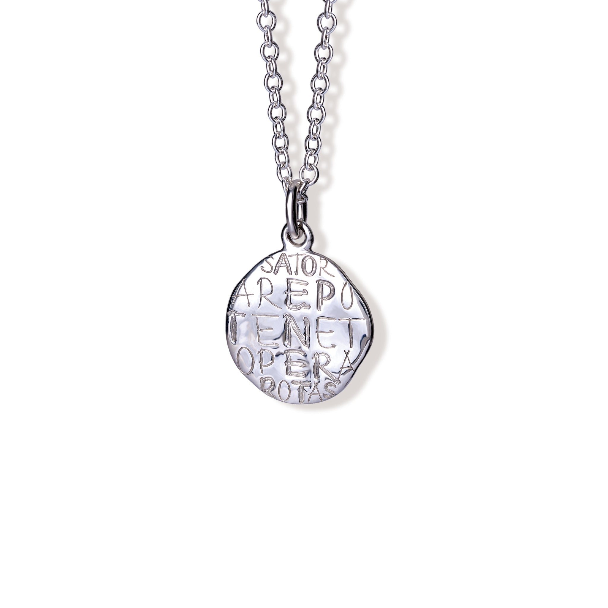 Handcrafted sterling silver necklace pendant engraved with the quote, 'Onwards.'