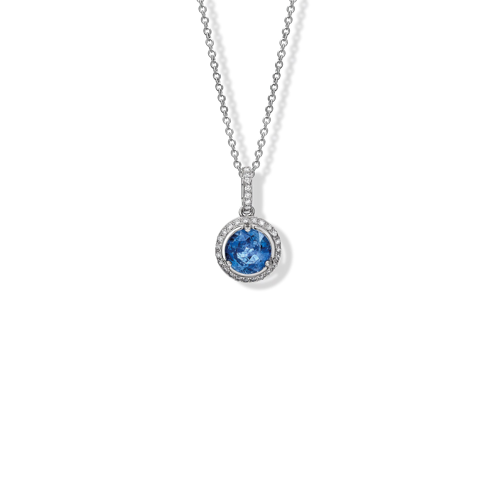 Handcrafted 18ct white gold necklace pendant featuring a circular kyanite with diamonds.
