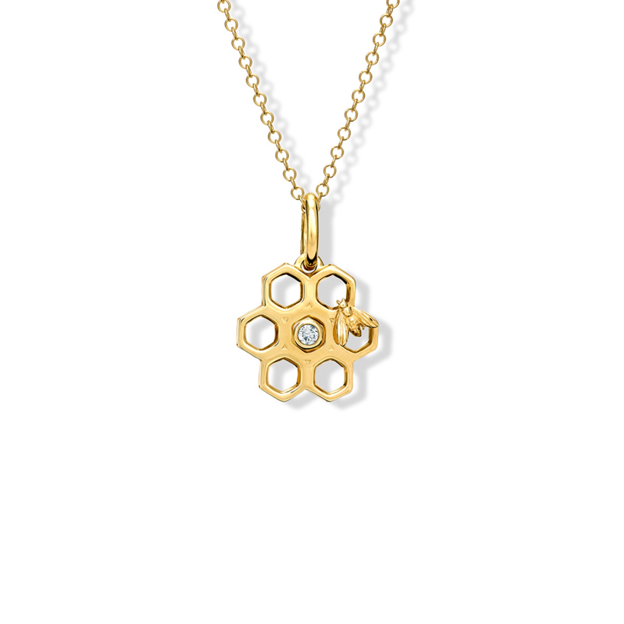 Handcrafted yellow gold honeycomb shaped necklace pendant with diamonds.