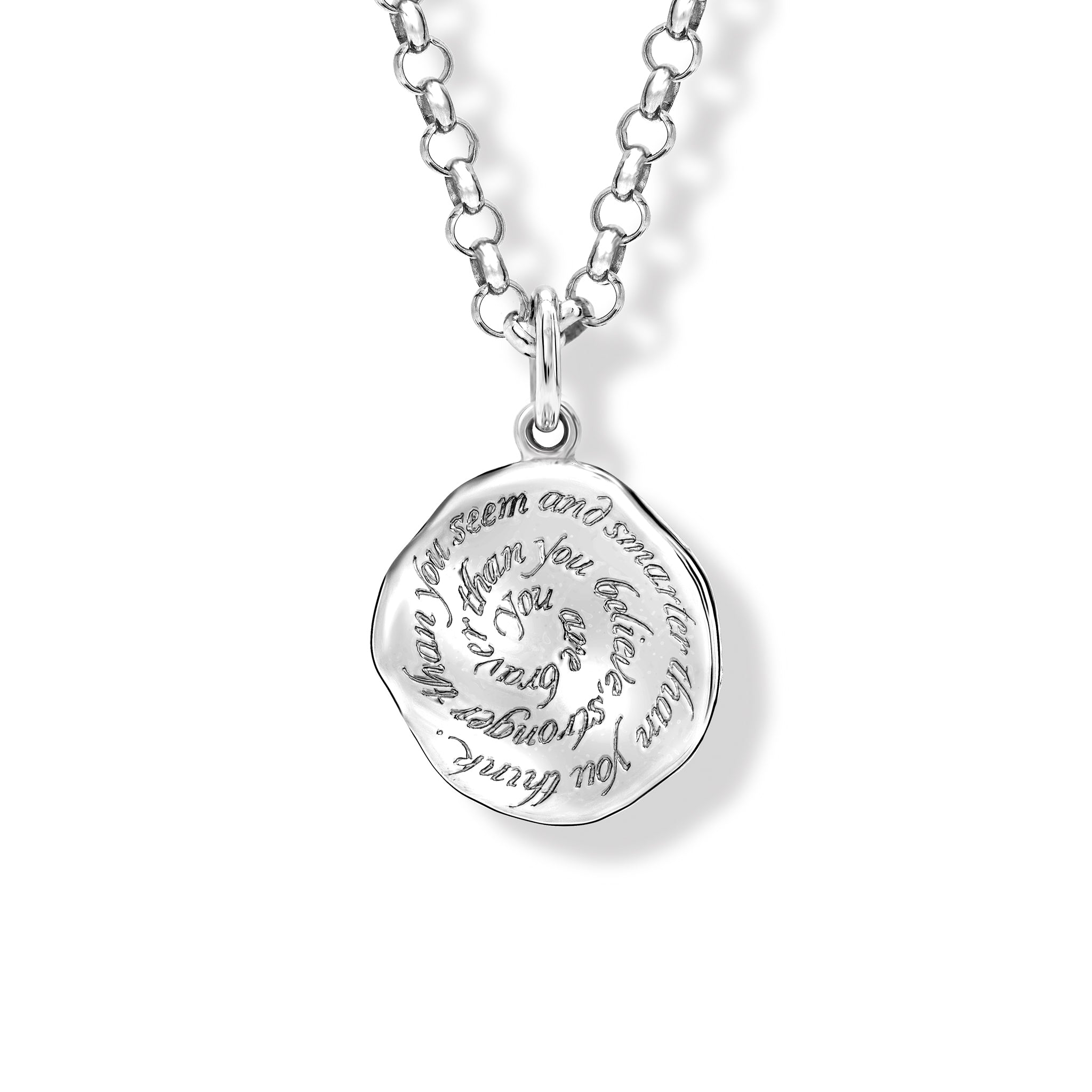 A handcrafted necklace pendant in precious metal featuring engraved text.