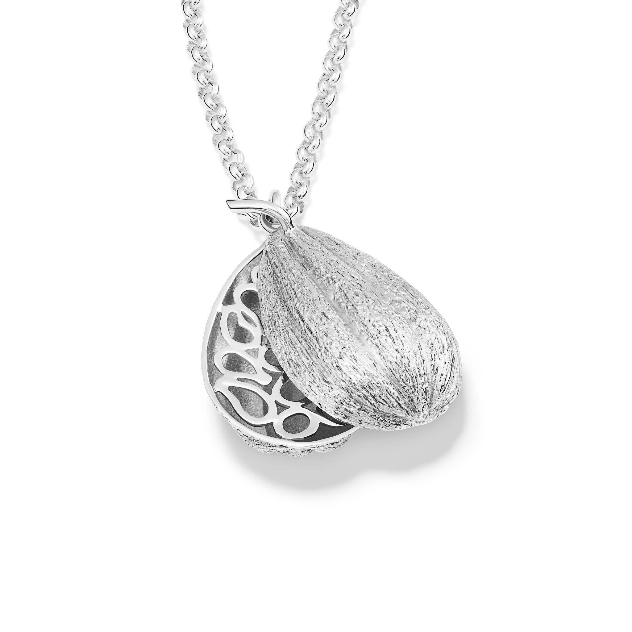 Handcrafted sterling silver necklace pendant in the shape of a cocoa pod which swivels open.