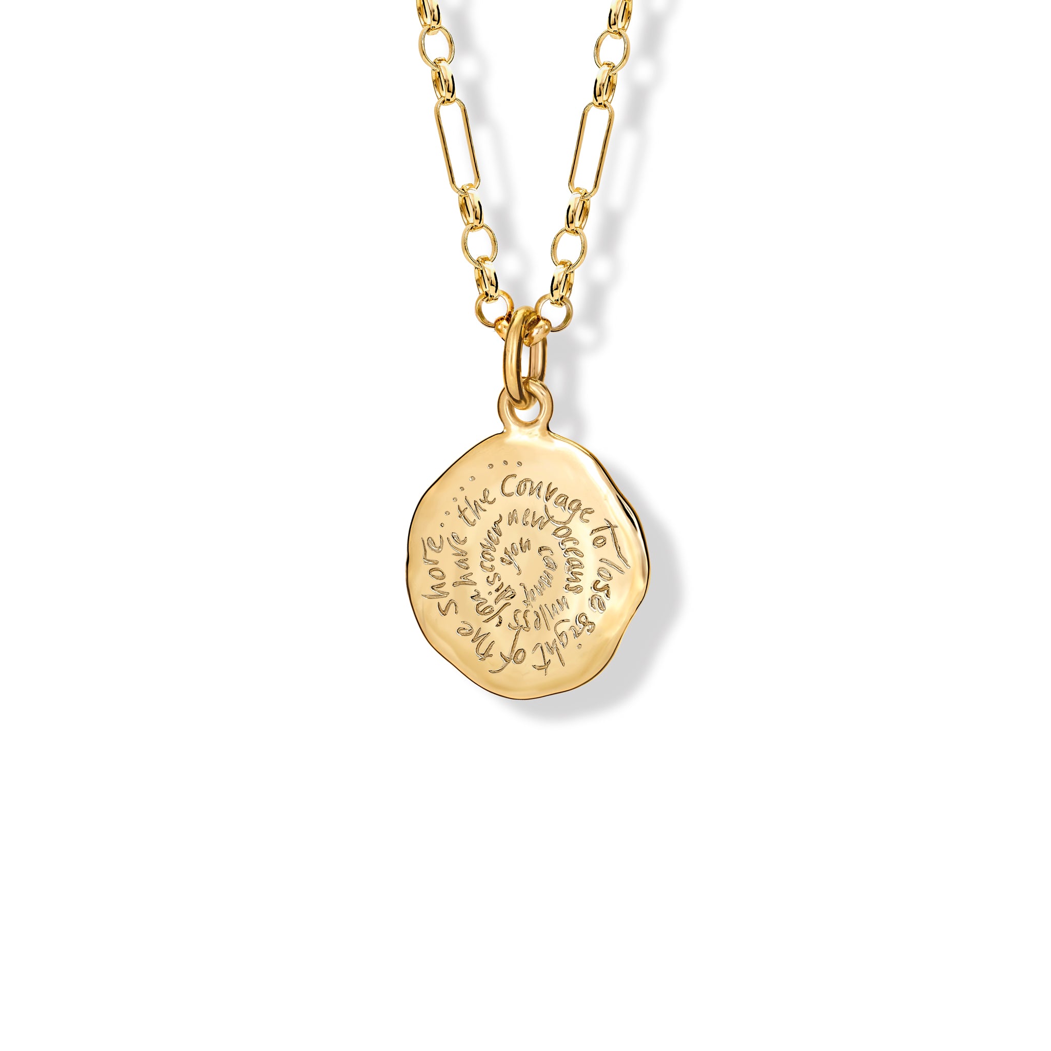 Handcrafted yellow gold round necklace pendant engraved with the quote, 'You cannot discover new oceans unless you have the courage to lose sight of the shore.'
