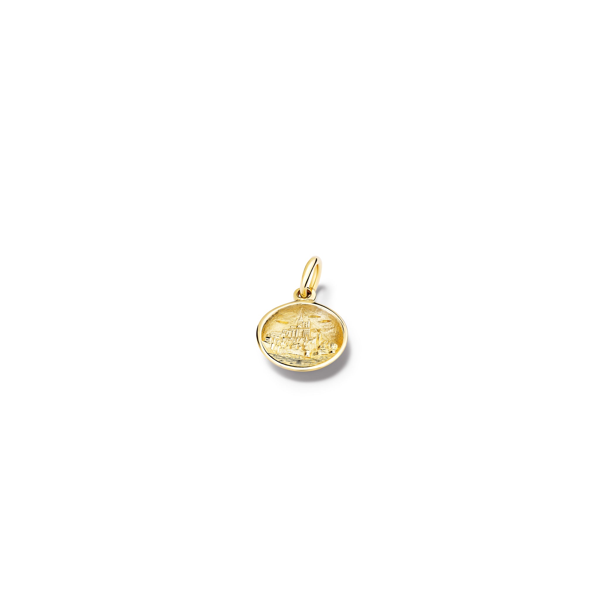 Handcrafted round yellow gold necklace pendant featuring an engraving of Mont Saint-Michel Abbey in France, with a loop at the top for chain attachment.