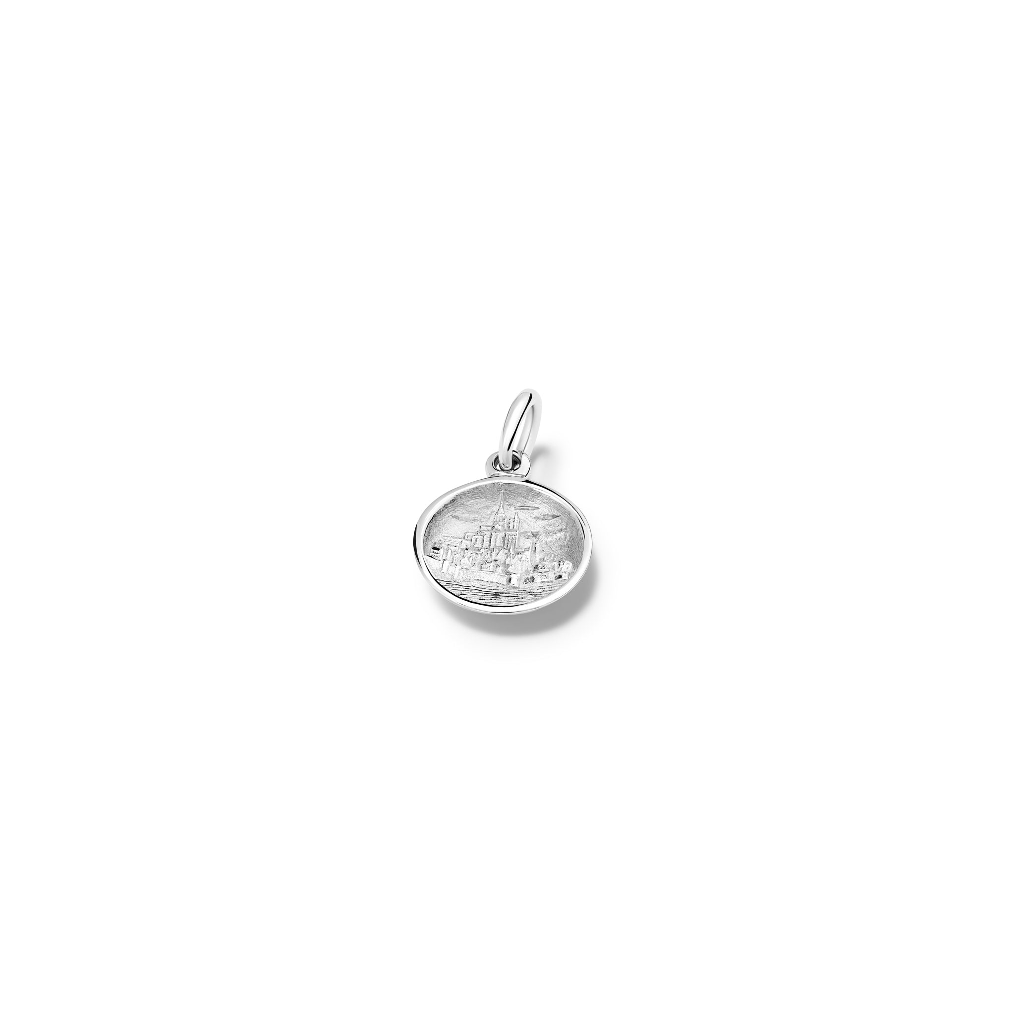 Handcrafted round sterling silver necklace pendant featuring an engraving of Mont Saint-Michel Abbey in France, with a loop at the top for chain attachment.