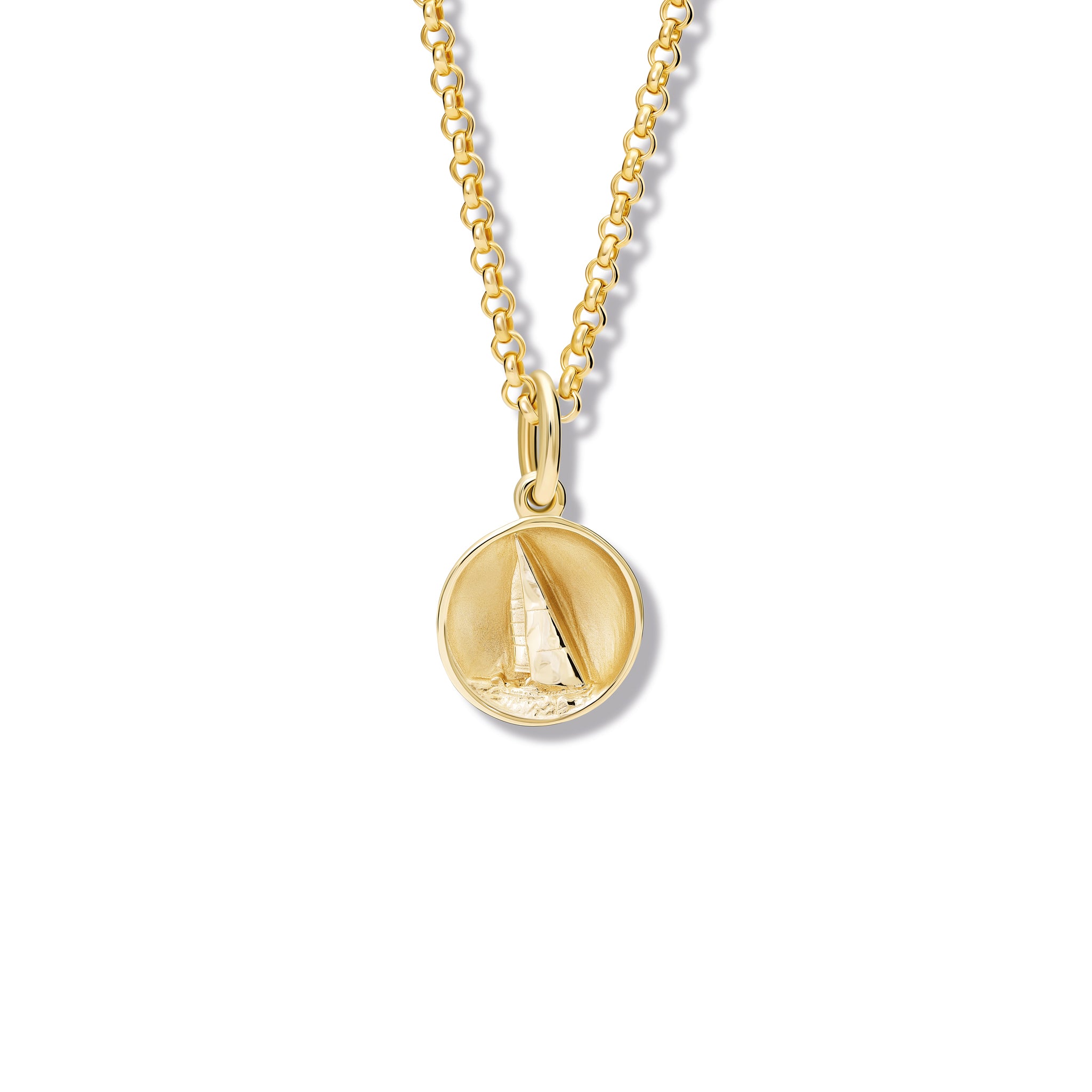 Handcrafted yellow gold necklace pendant 'en relief' with a sailing boat in France.