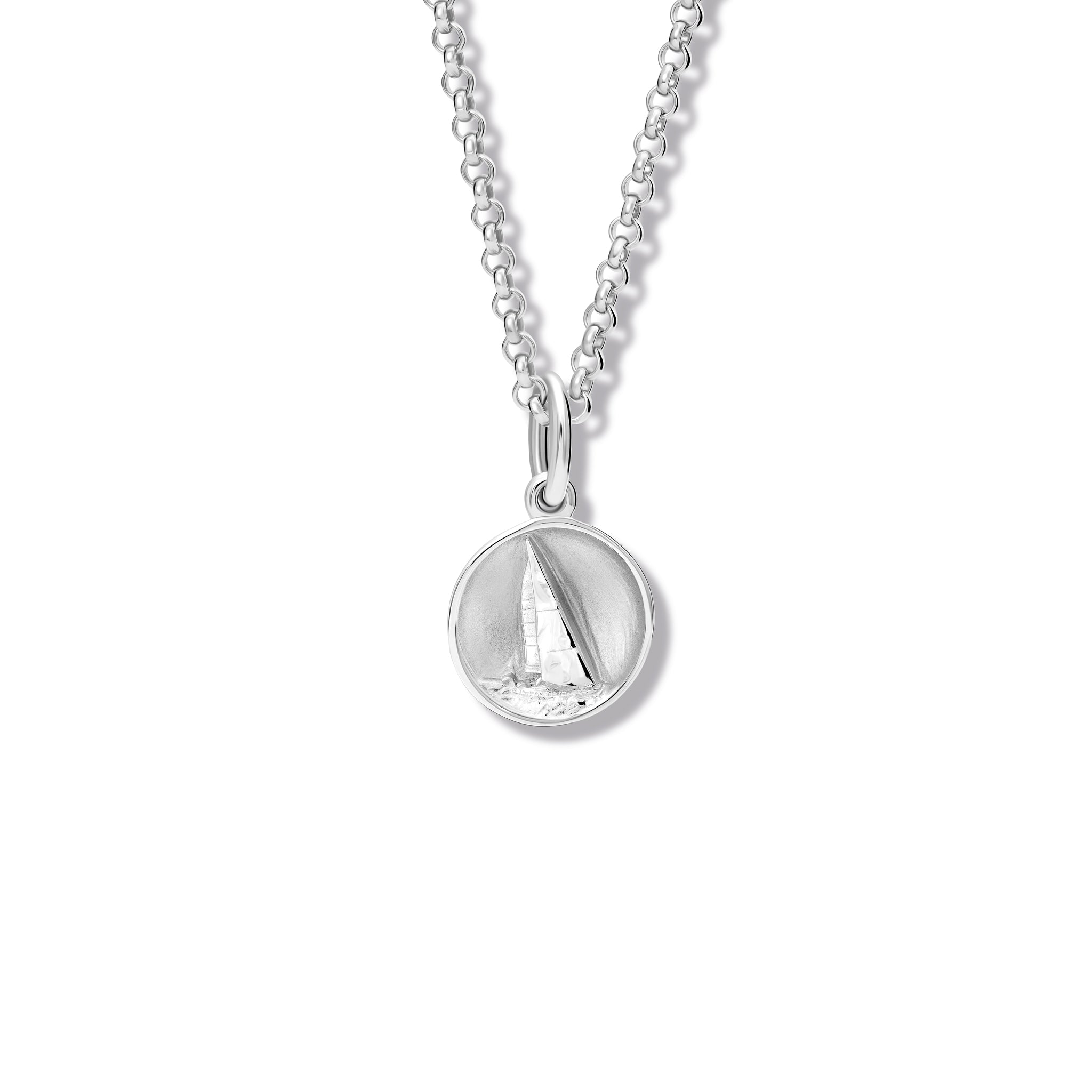 Handcrafted sterling silver necklace pendant 'en relief' with a sailing boat in France. 