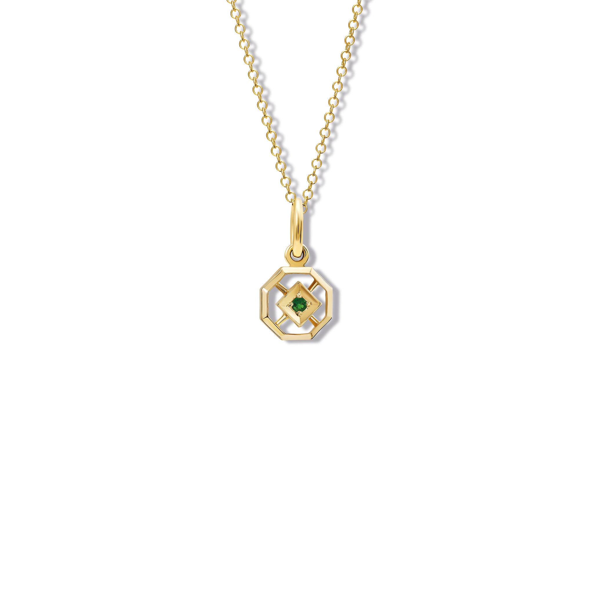 Handcrafted yellow gold necklace pendant featuring an octagonal design with a central emerald, birthstone of May.