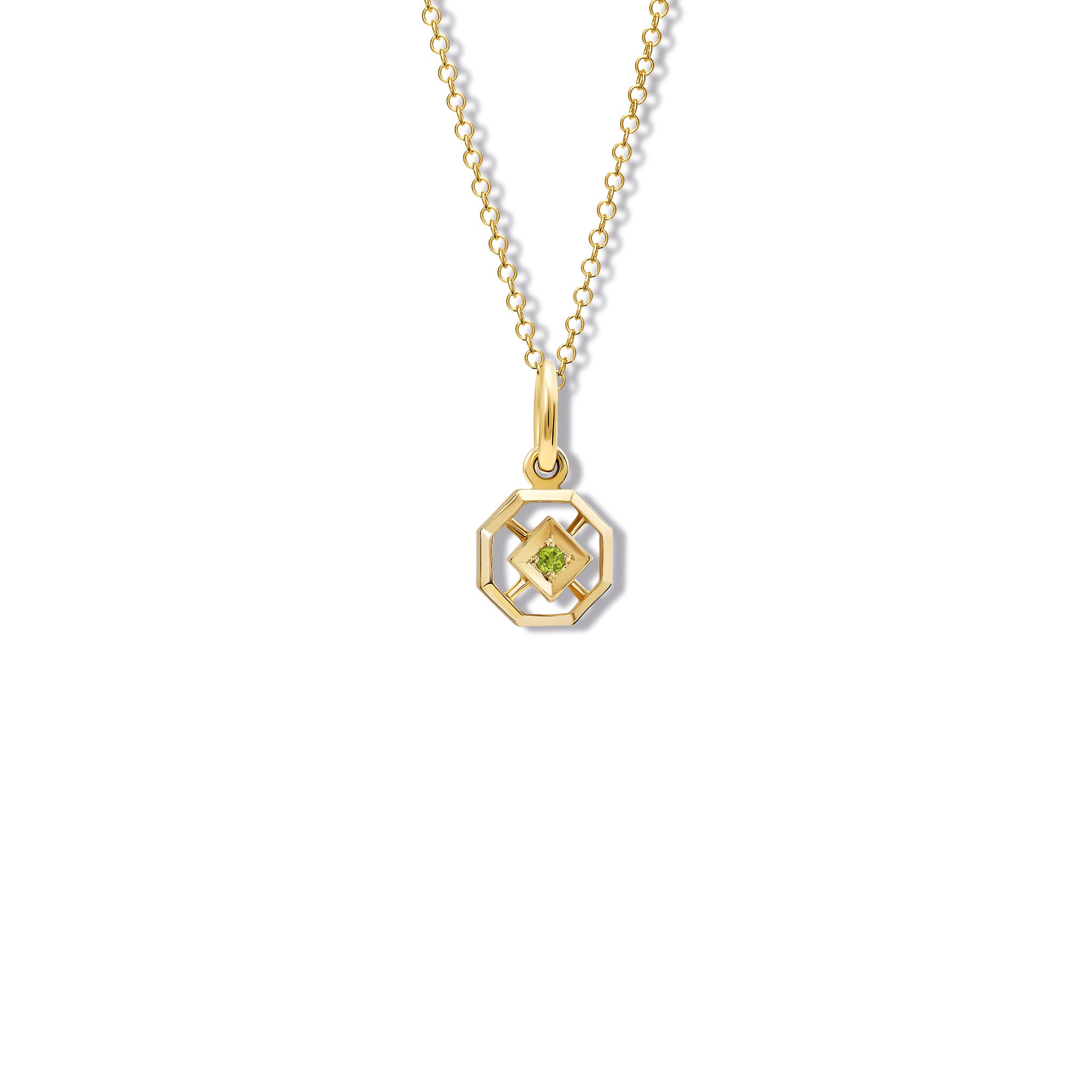 Handcrafted yellow gold necklace pendant featuring an octagonal design with a central peridot, birthstone of August.