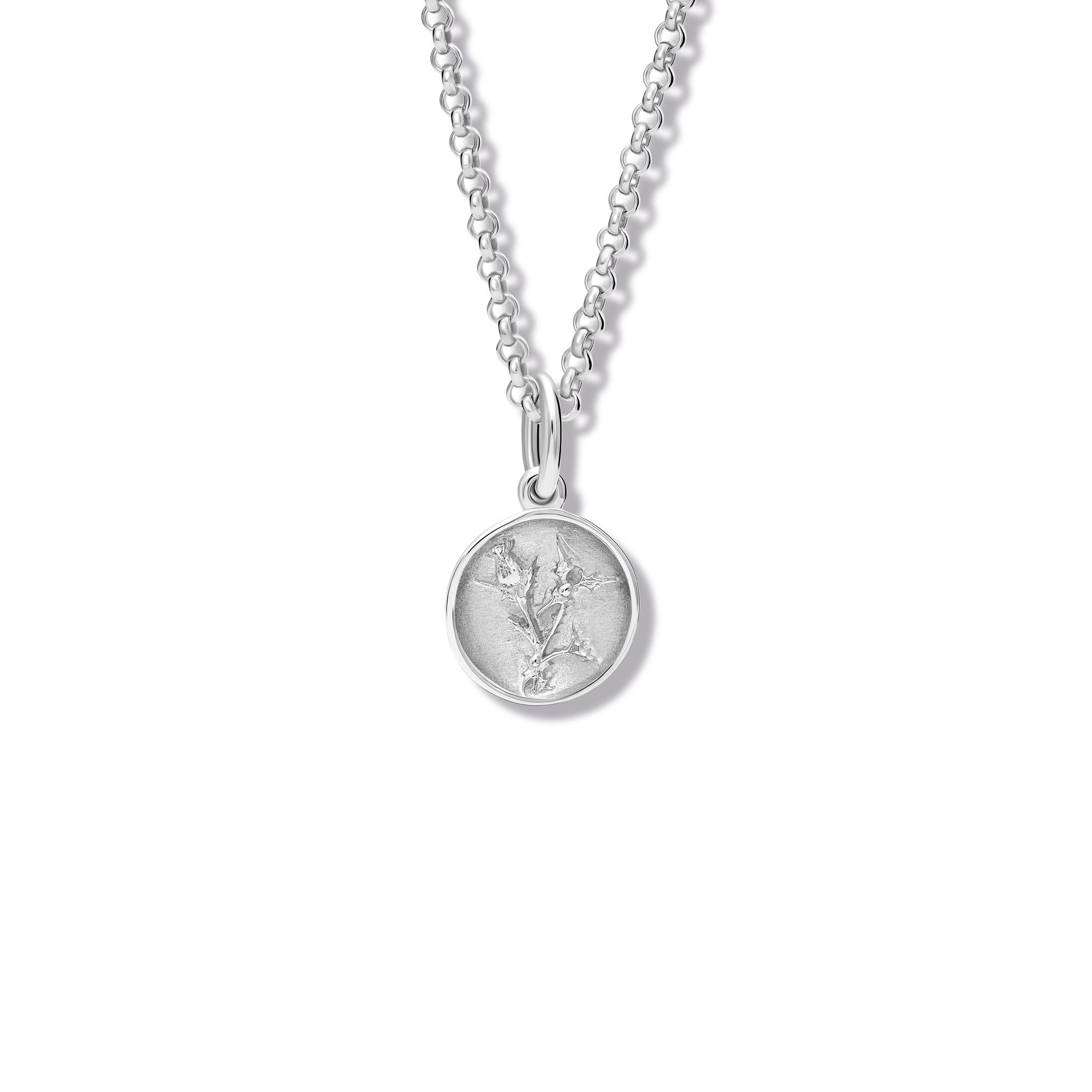 Handcrafted sterling silver necklace pendant 'en relief' with a thistle.
