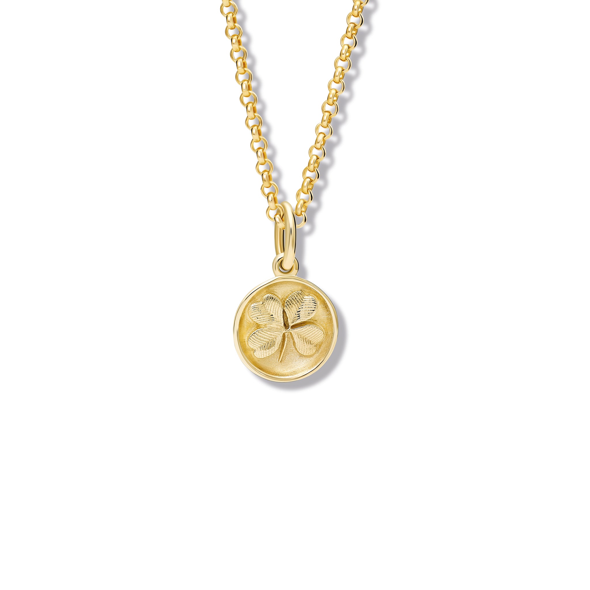 Handcrafted yellow gold necklace pendant 'en relief' with a shamrock.
