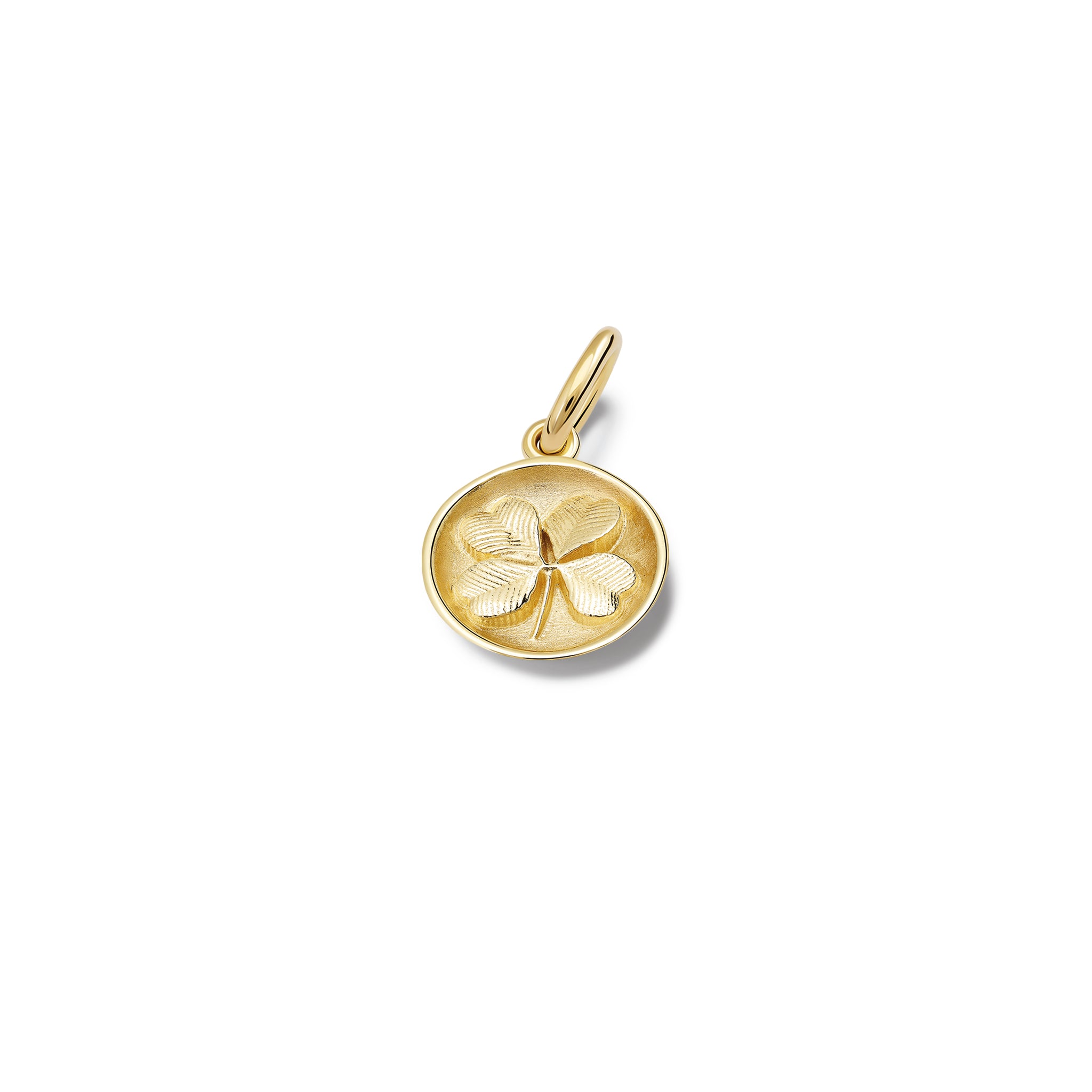 Handcrafted yellow gold necklace pendant 'en relief' with a shamrock.
