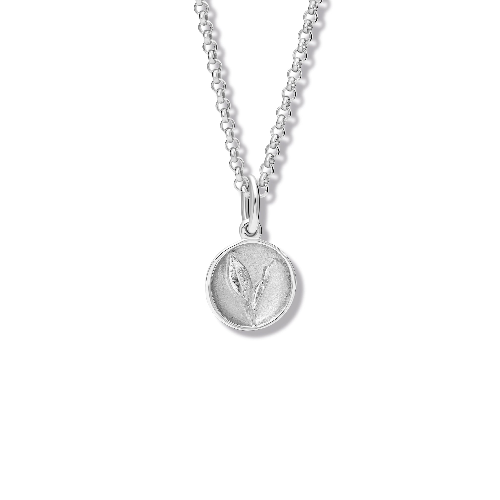 Handcrafted sterling silver necklace pendant 'en relief' with a lily of the valley.