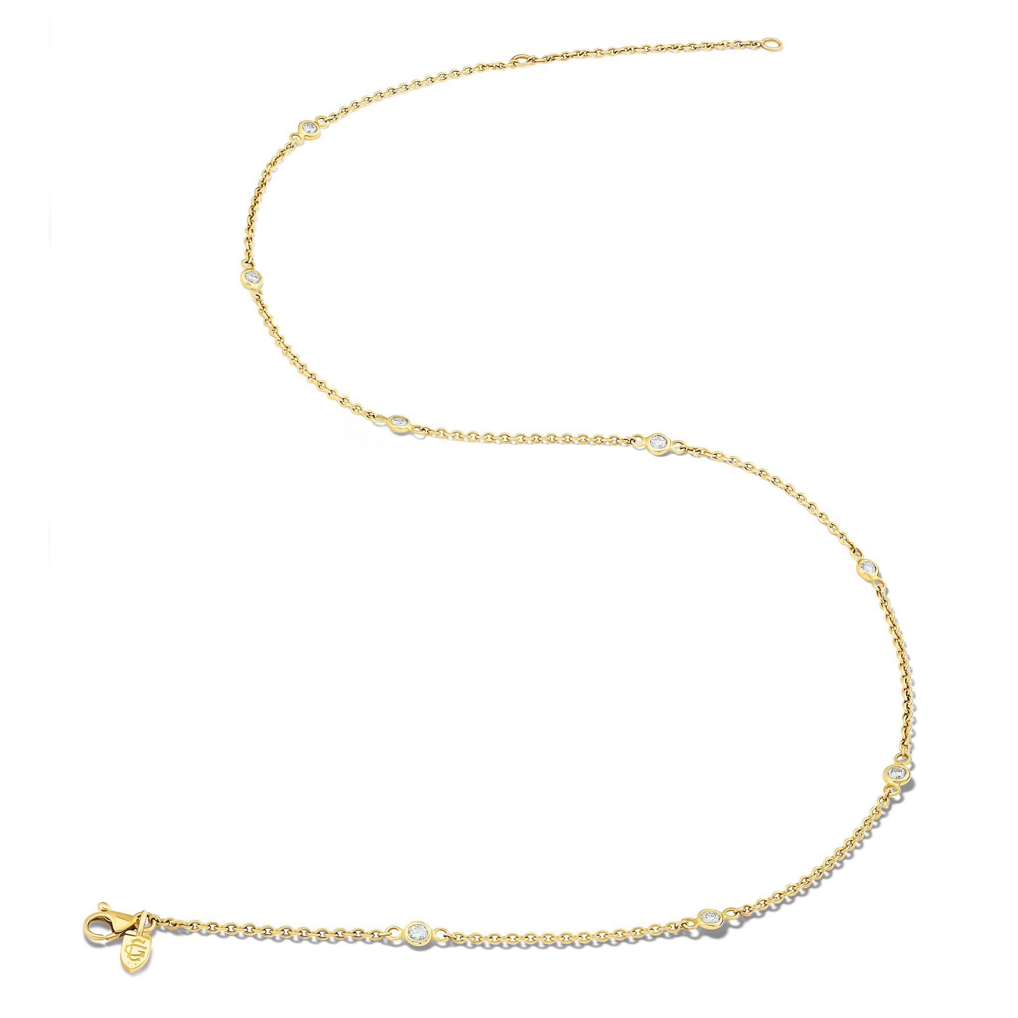 Handcrafted yellow gold necklace chain with round facetted diamonds.