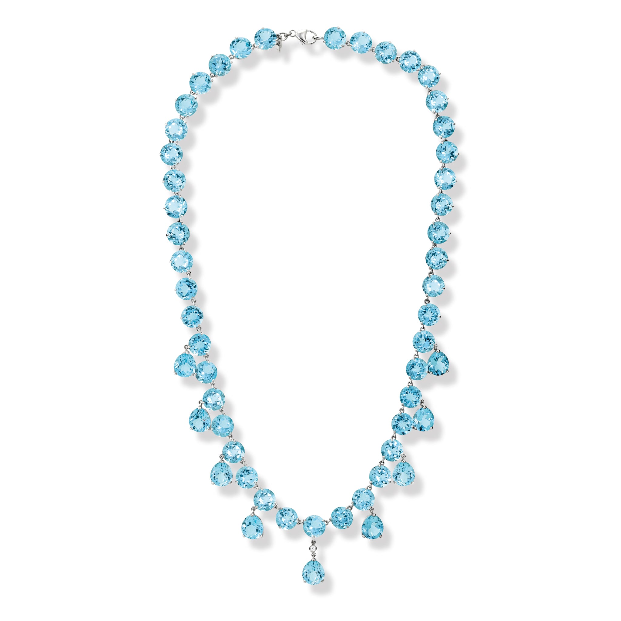 Handcrafted white gold necklace featuring circular and drop blue topaz gemstones.
