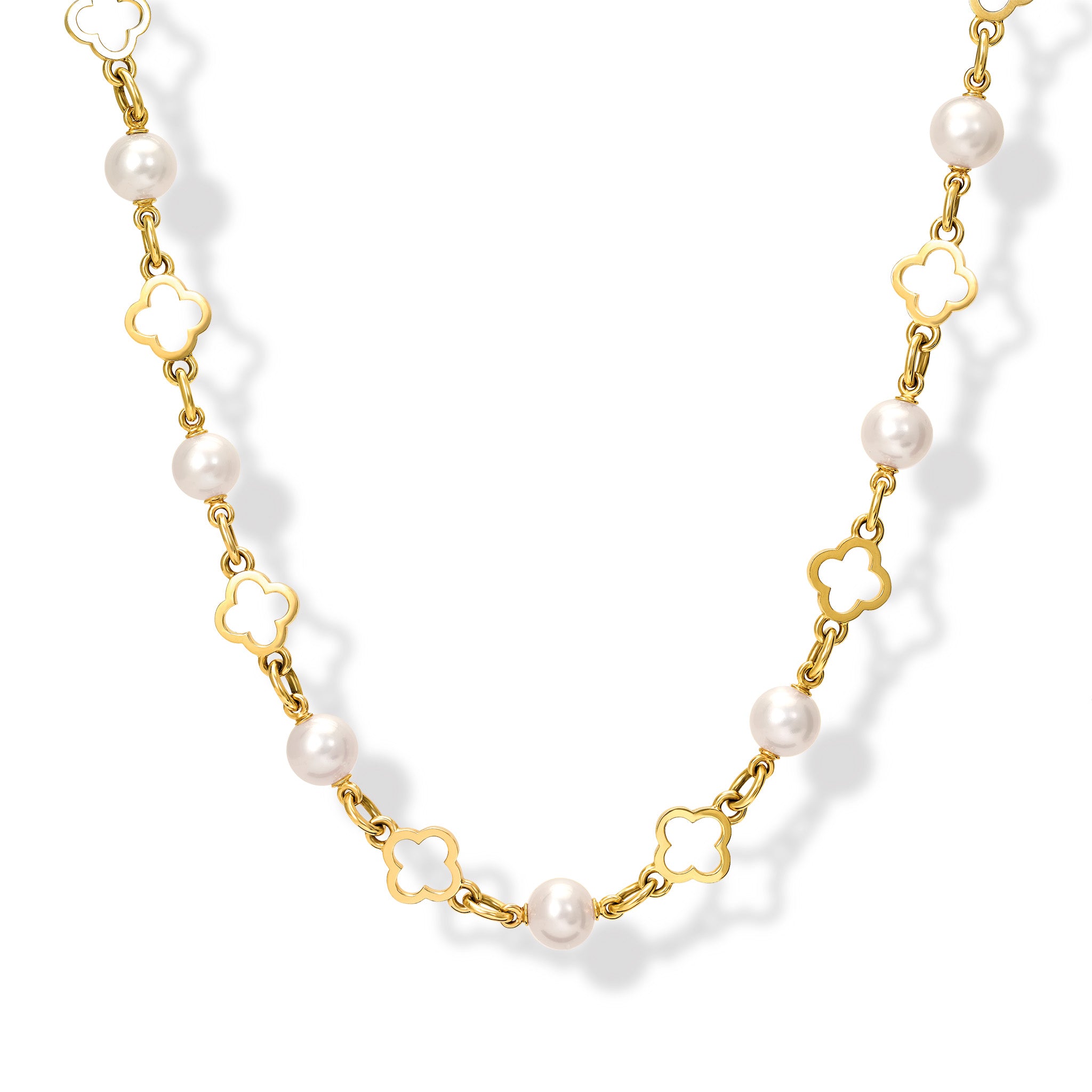 Handcrafted yellow gold necklace with star-shaped links, spaced with pearls, birthstone of June.
