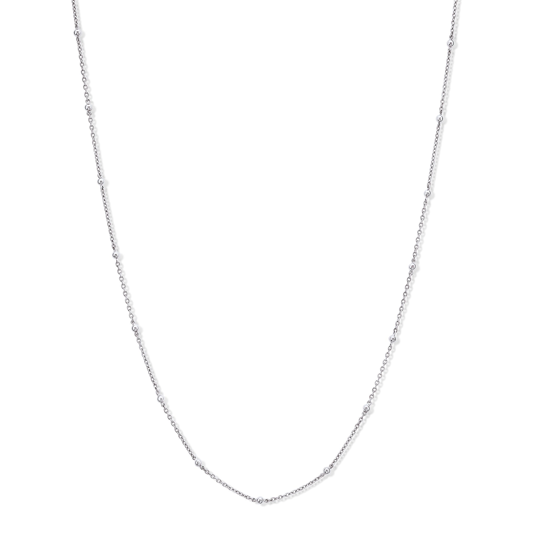 Handcrafted white gold necklace chain with small gold beads.
