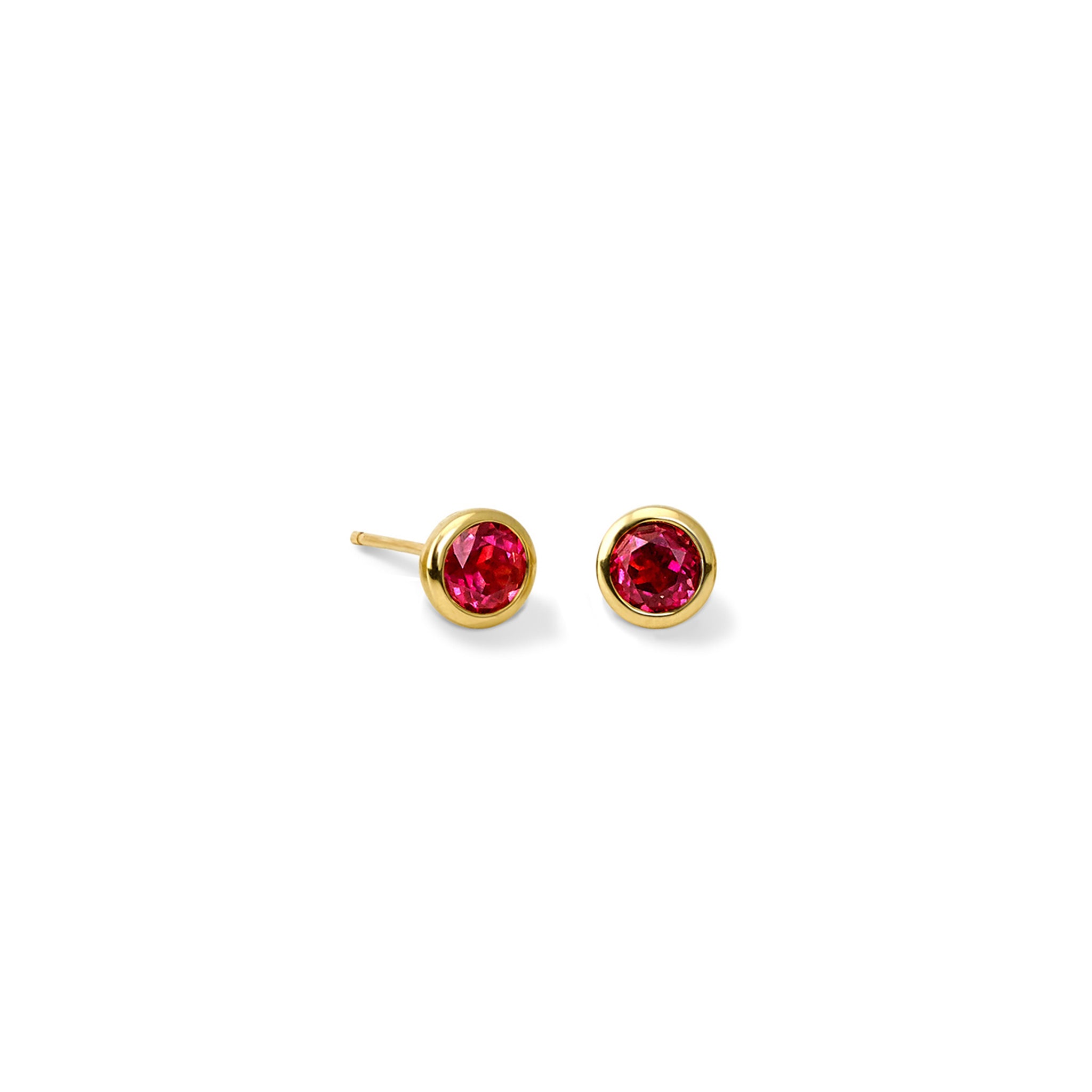 Handcrafted yellow gold stud earrings featuring round garnet, birthstone of January.