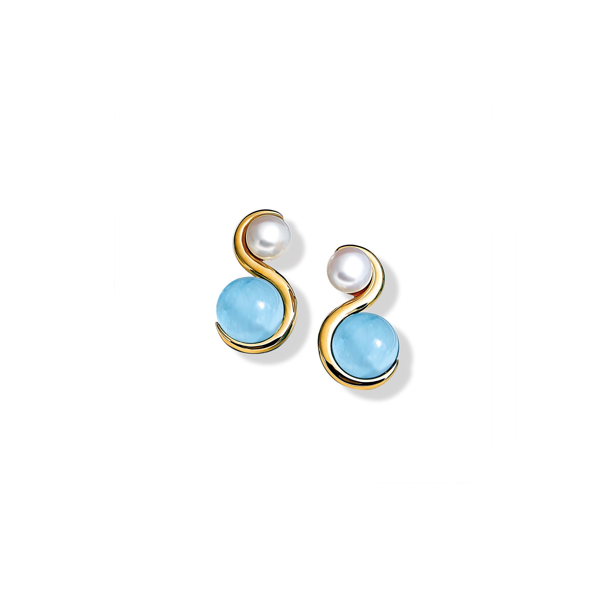 Handcrafted yellow gold earrings featuring an 's' shape linking the aquamarine and pearl.
