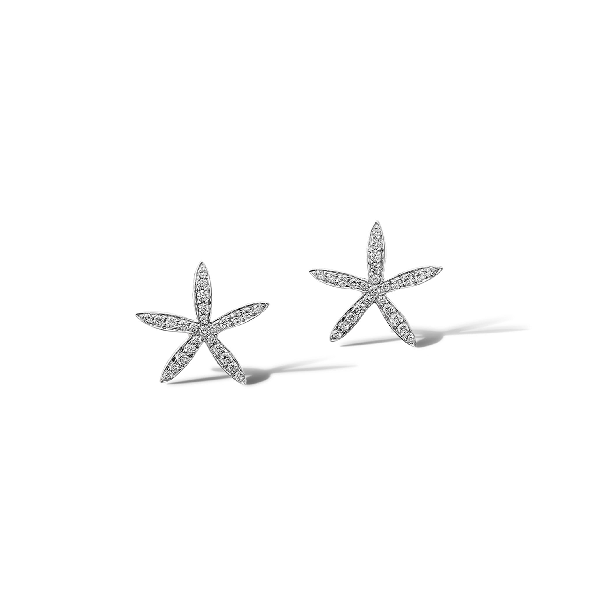 Handcrafted white gold starfish shaped earrings with diamonds.