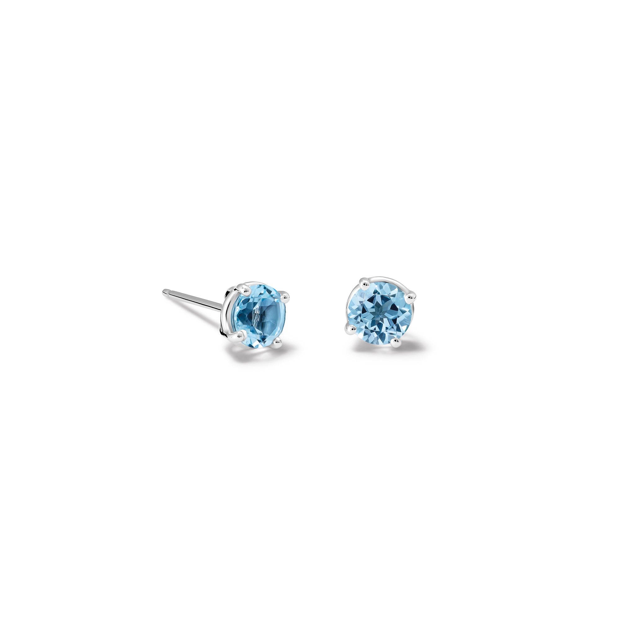 Handcrafted white gold stud earrings featuring round blue topaz gemstones, birthstone of November.