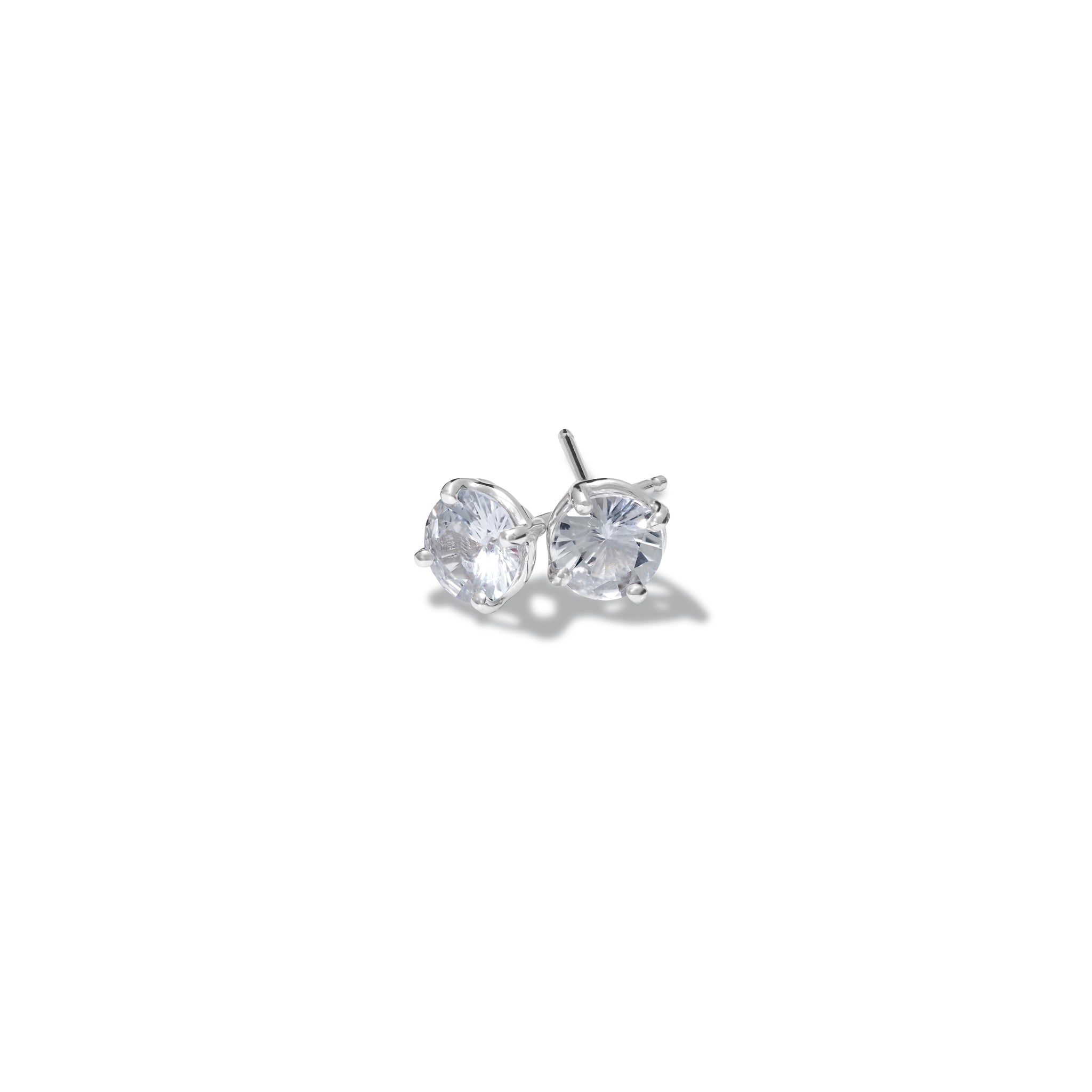 Handcrafted 18ct white gold stud earrings featuring round white sapphire, birthstone of september.