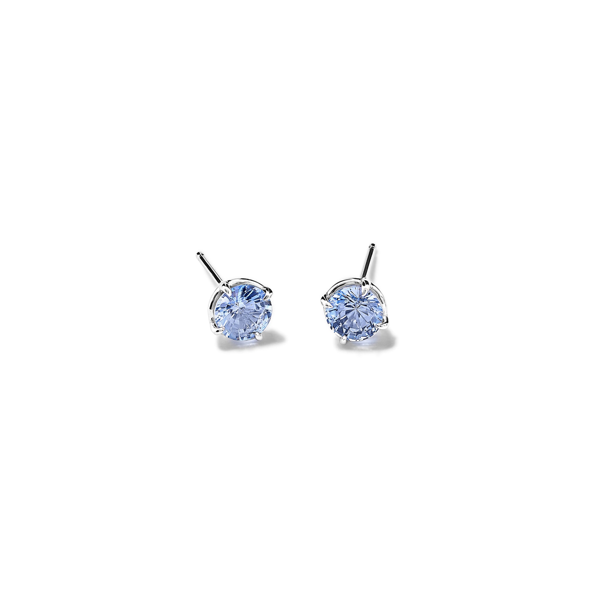 Handcrafted 18ct white gold stud earrings featuring round pale sapphire, birthstone of September.