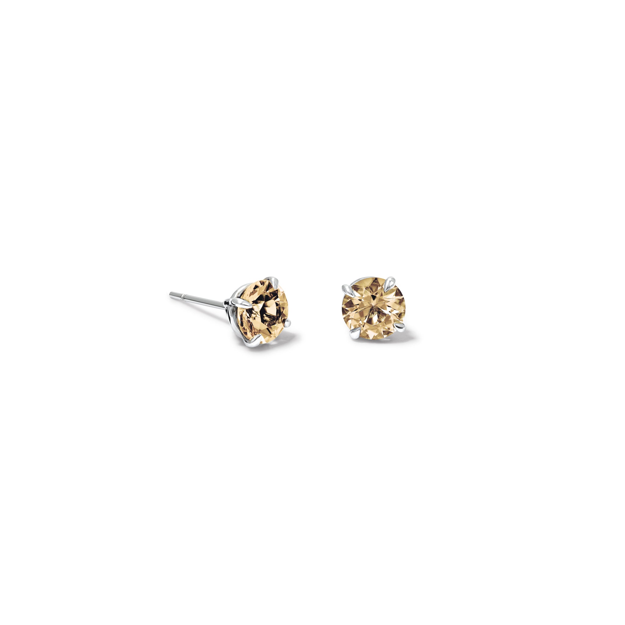 Handcrafted 18ct white gold stud earrings featuring round champagne coloured diamonds, birthstone of April.