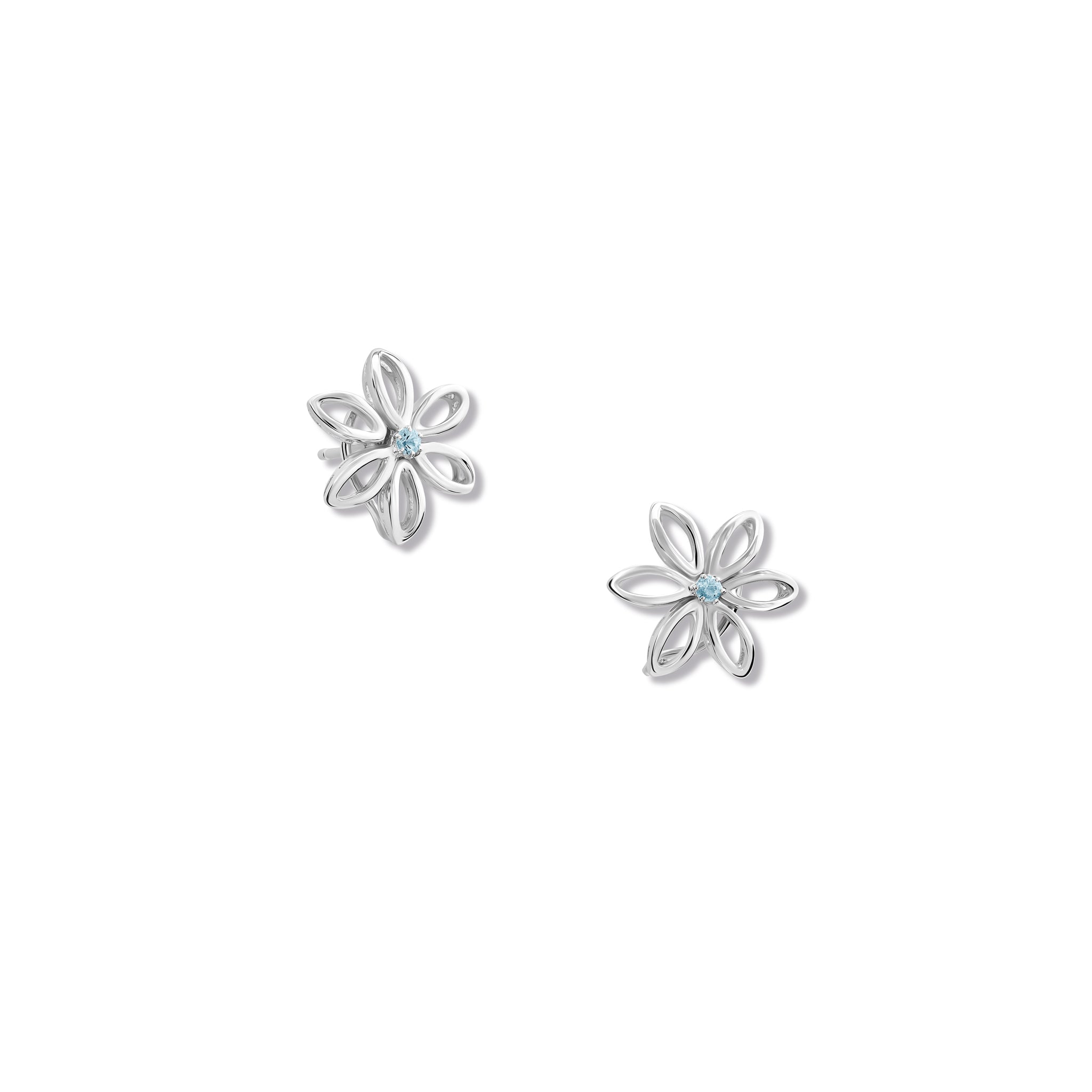 Handcrafted sterling silver flower studs with a central blue topaz, birthstone of November.