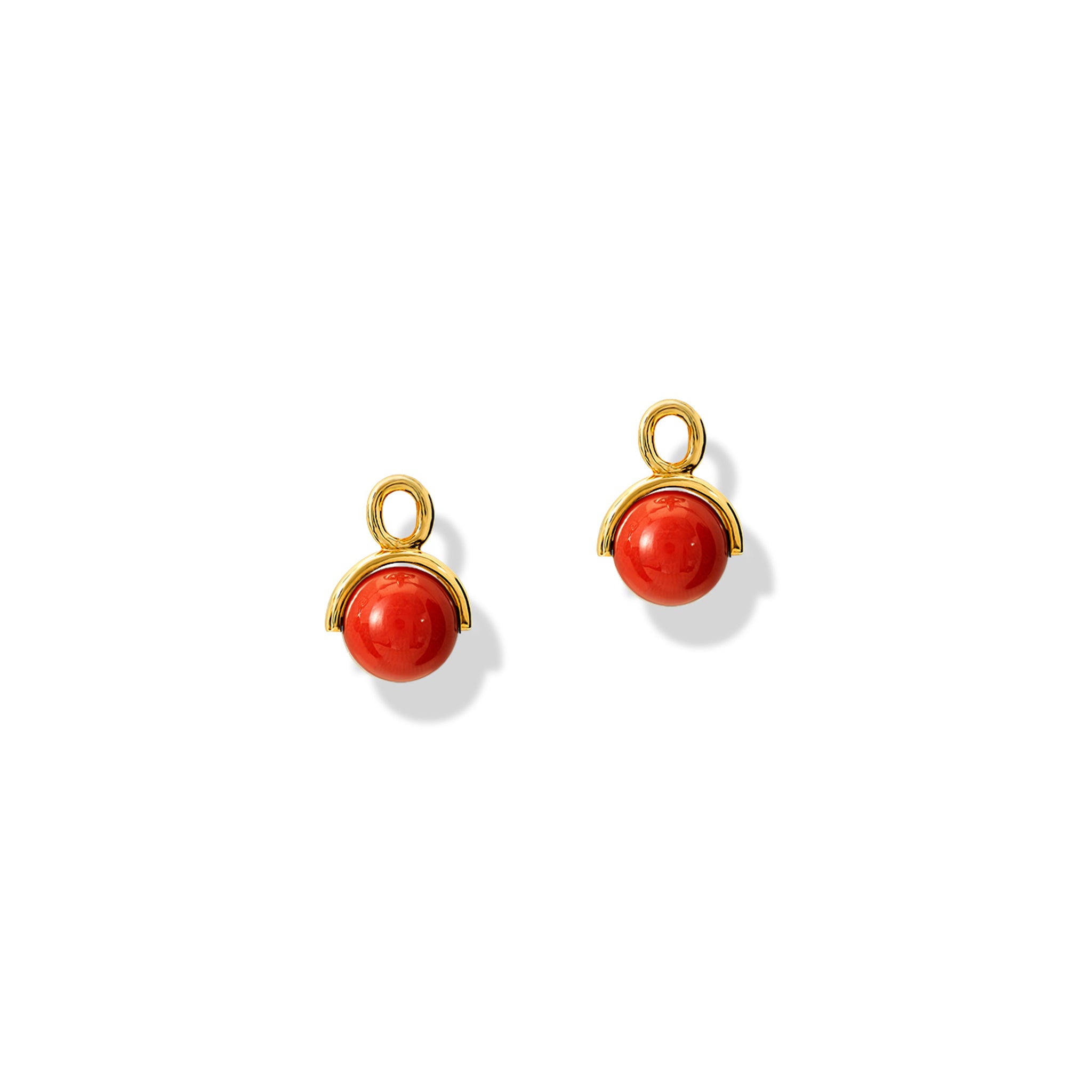 Handcrafted yellow gold earring drops featuring coral beads.
