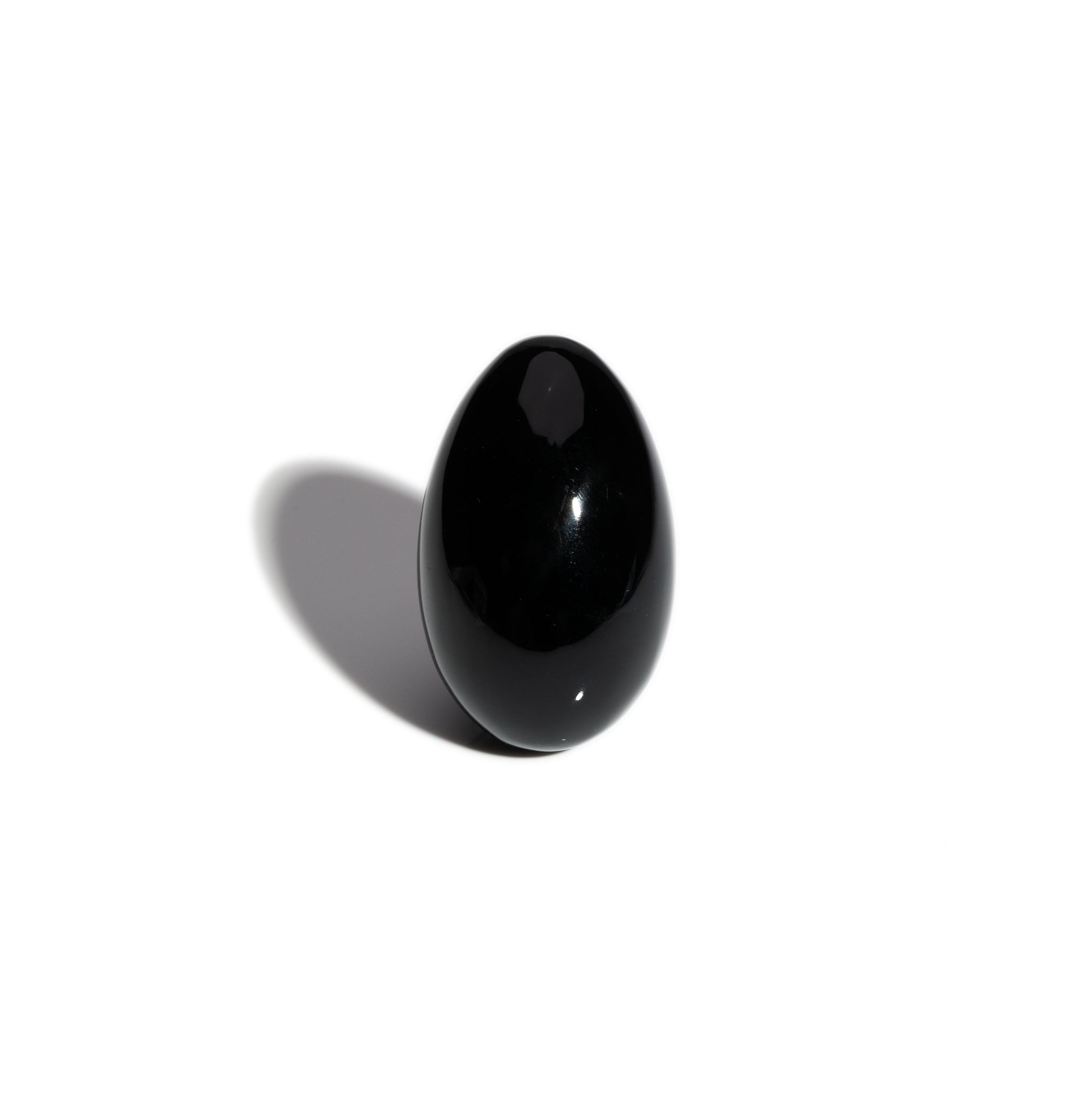 A handcrafted gemstone egg in the precious stone obsidian. 