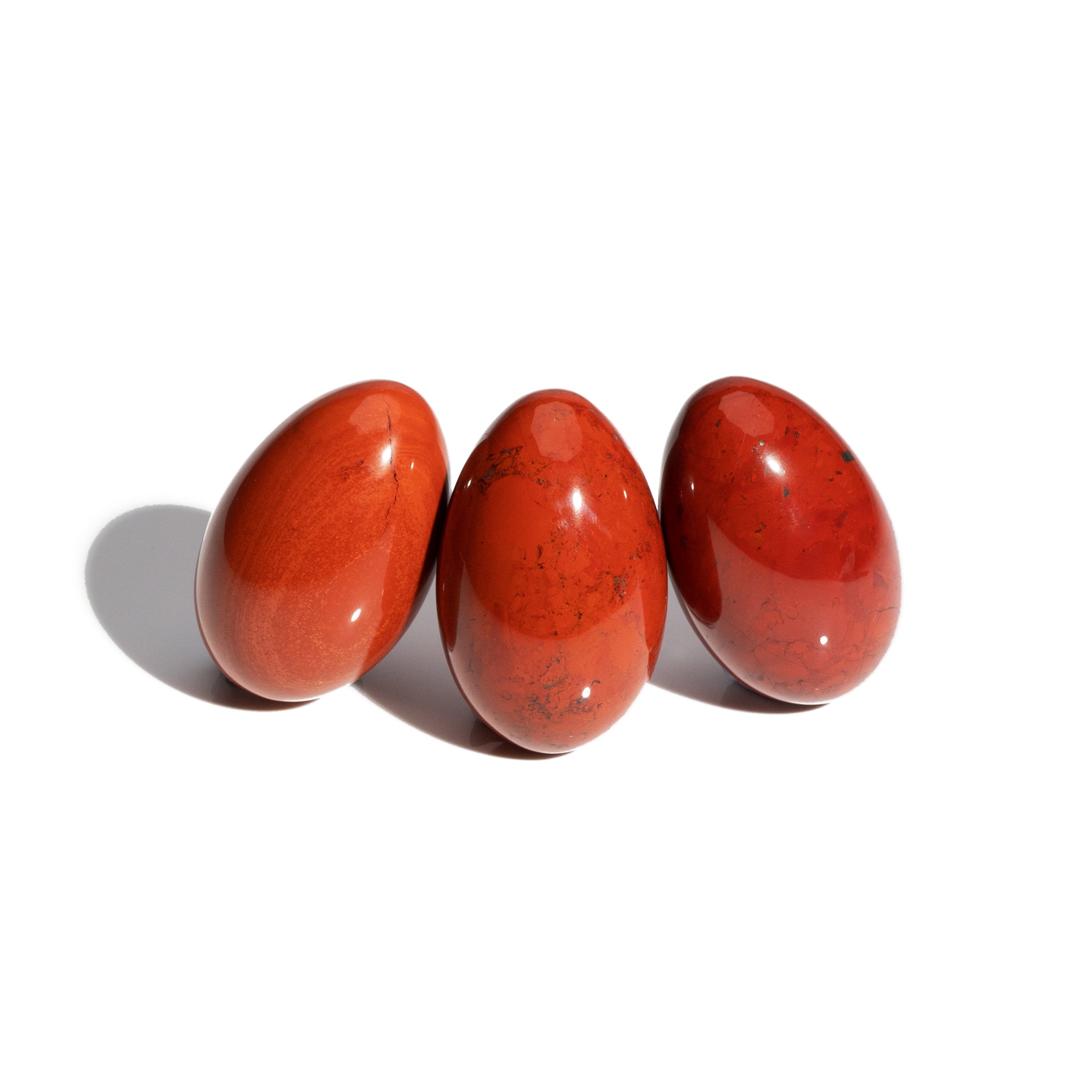 Three handcrafted gemstone eggs in the precious stone red jasper. 