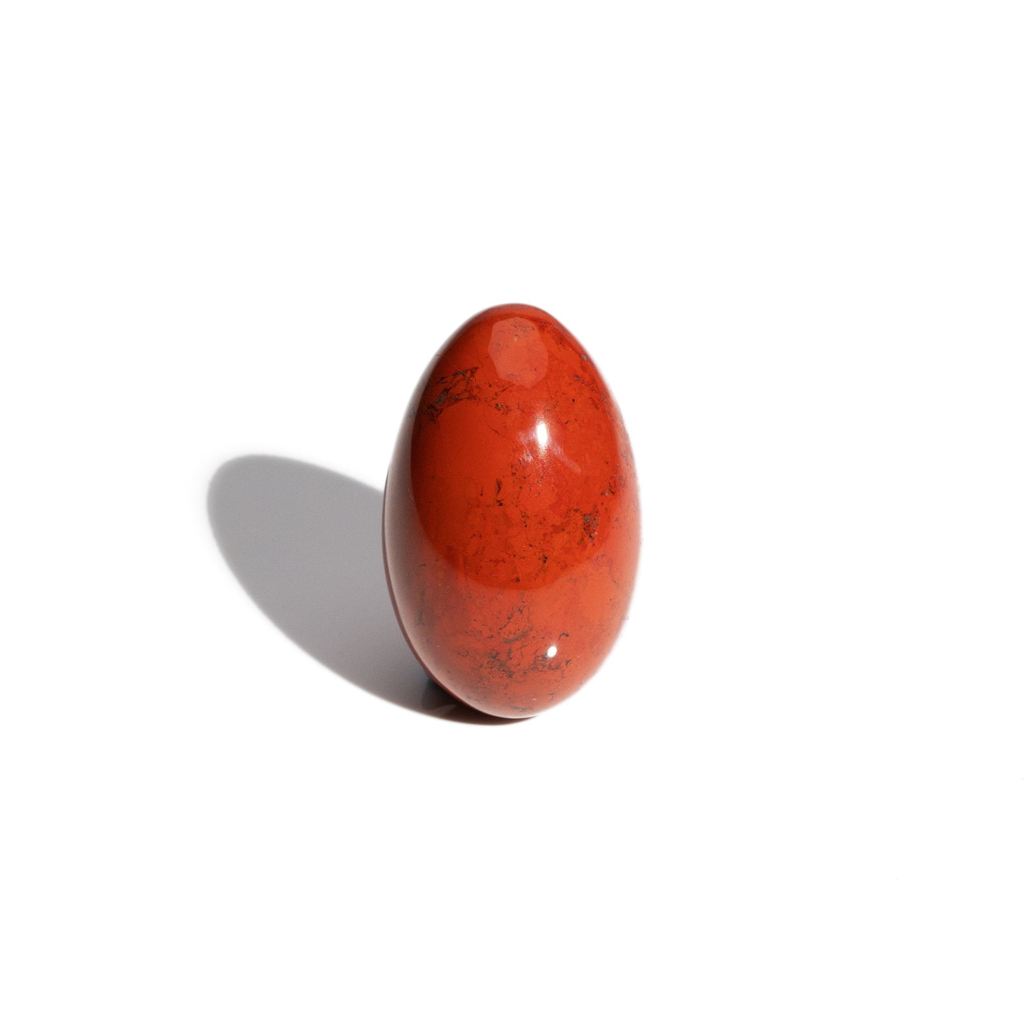 A handcrafted gemstone egg in the precious stone red jasper. 