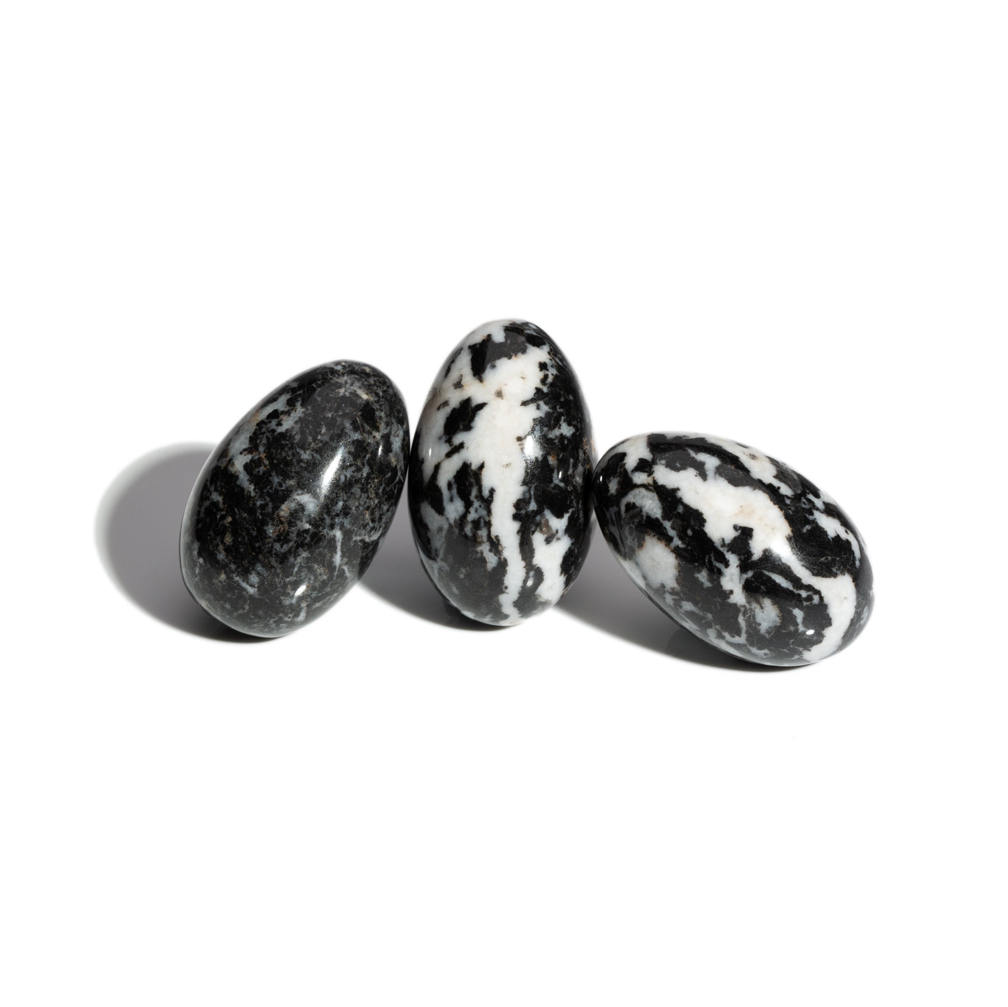 Three handcrafted gemstone eggs in the precious stone zebra jasper. 