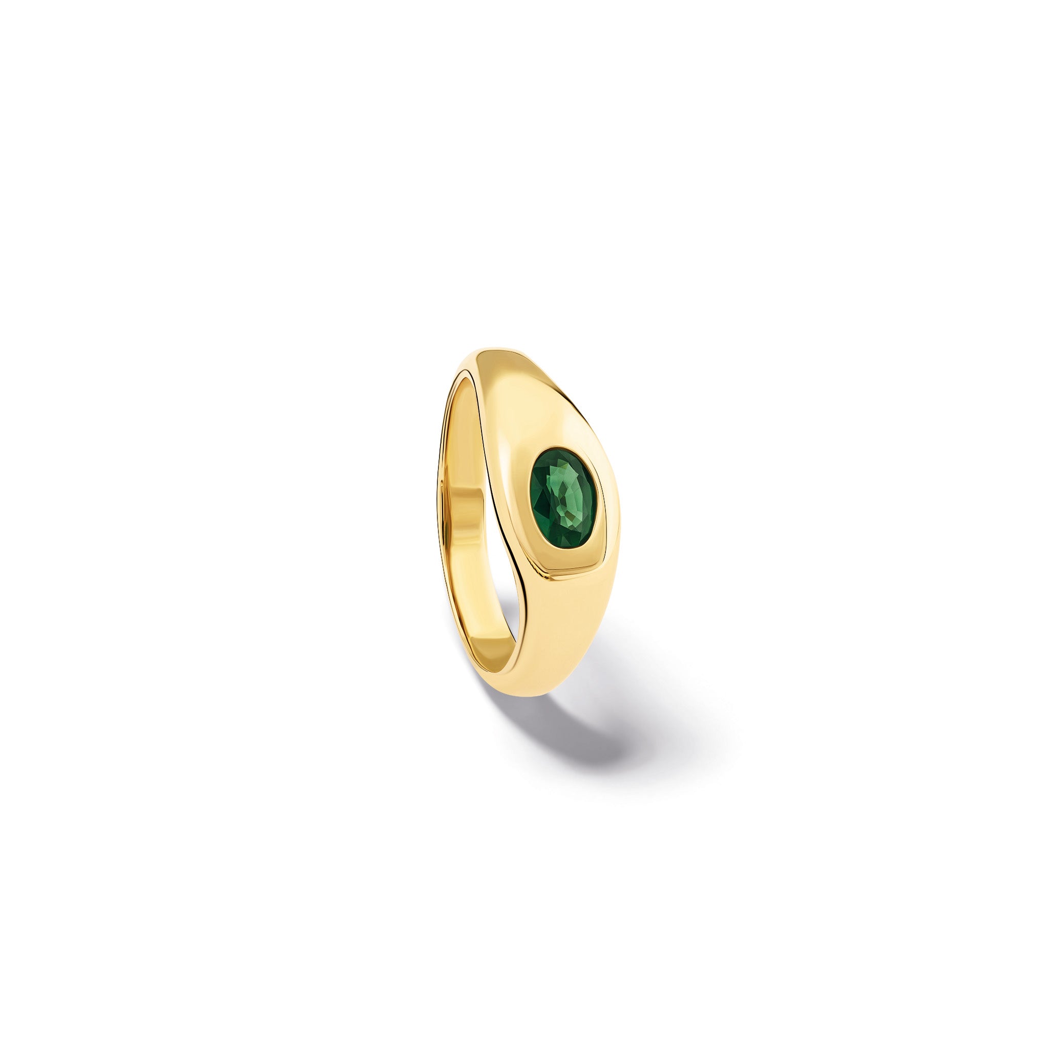 Handcrafted yellow gold ring with a slight teardrop design set with an oval facetted green sapphire.