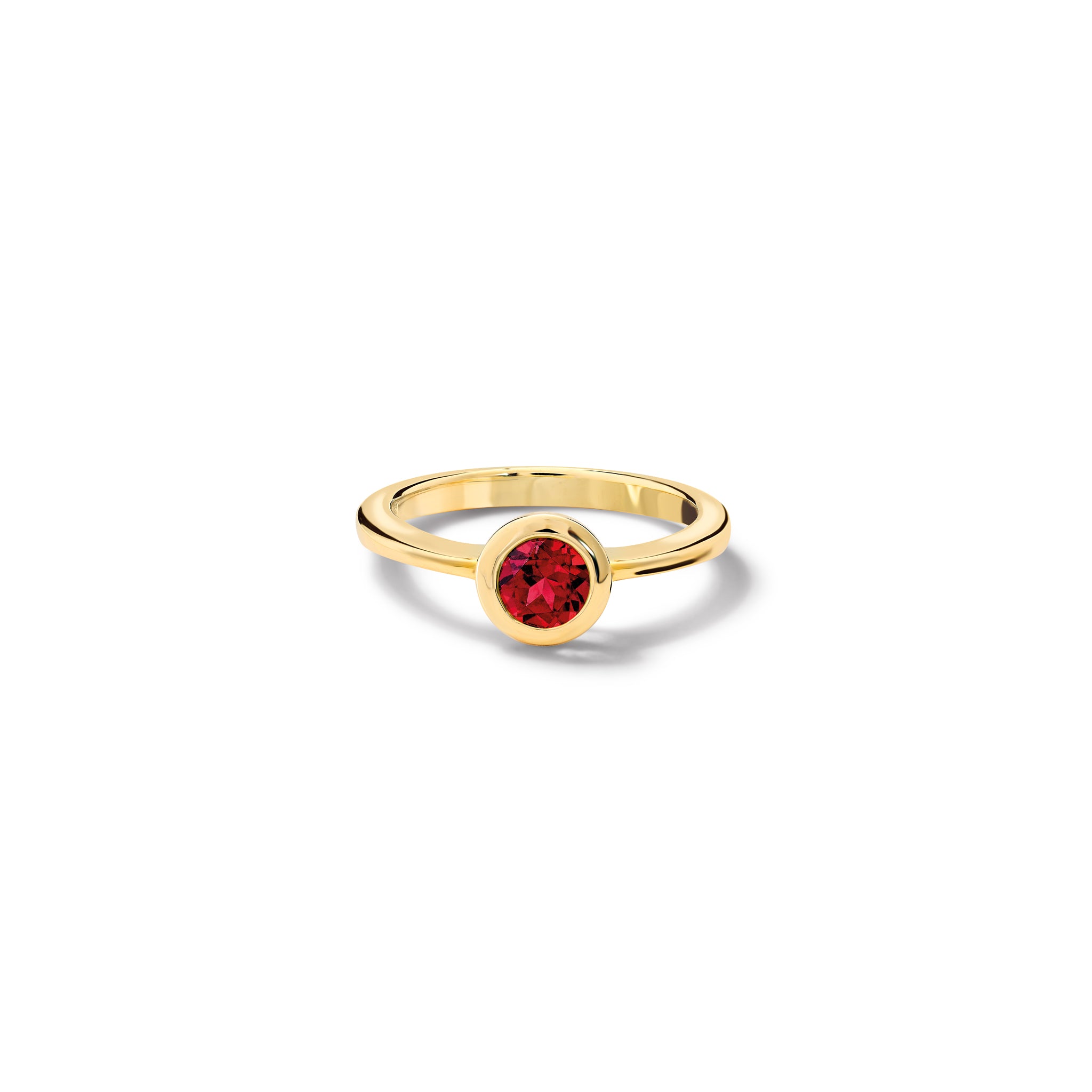 Handcrafted yellow gold ring with a central garnet, birthstone of January. 