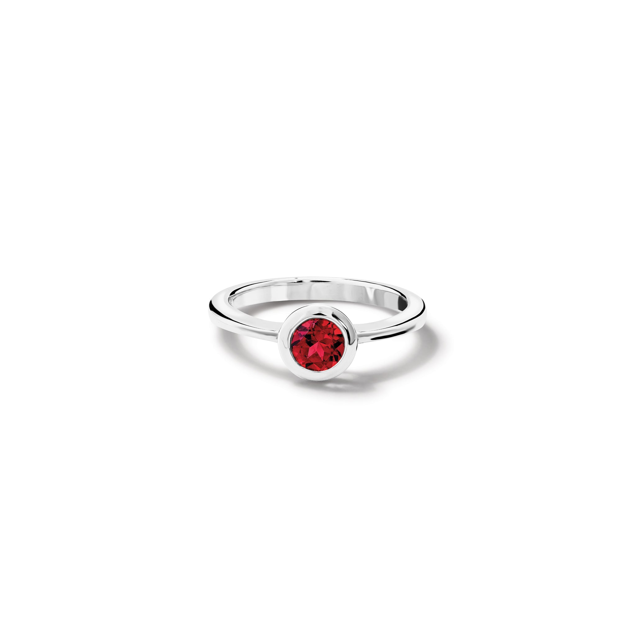 Handcrafted sterling silver ring with a central garnet, birthstone of January. 