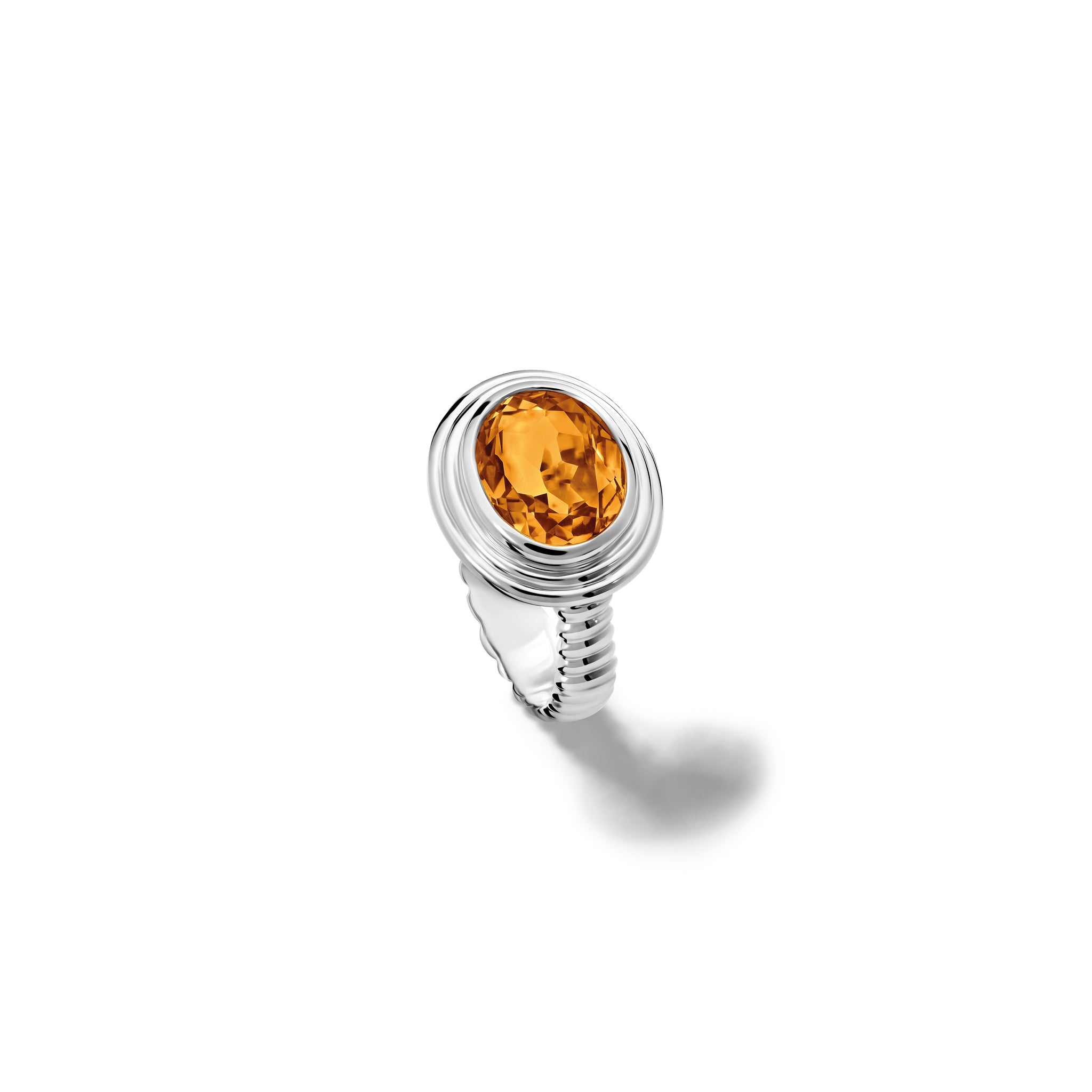 Handcrafted sterling silver ring featuring a prominent oval citrine, birthstone of November.